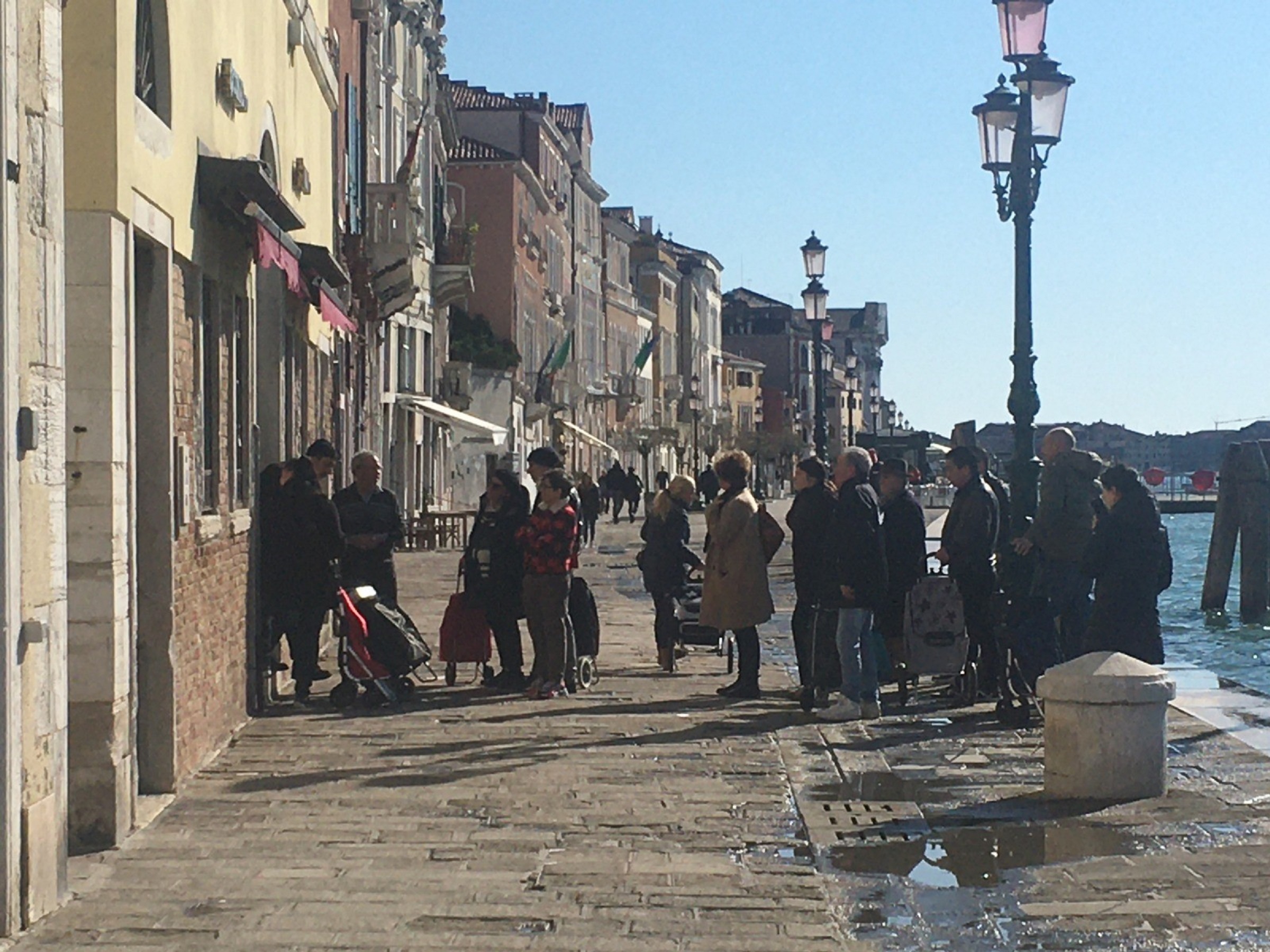 People queuing outside a supermarket in Venice