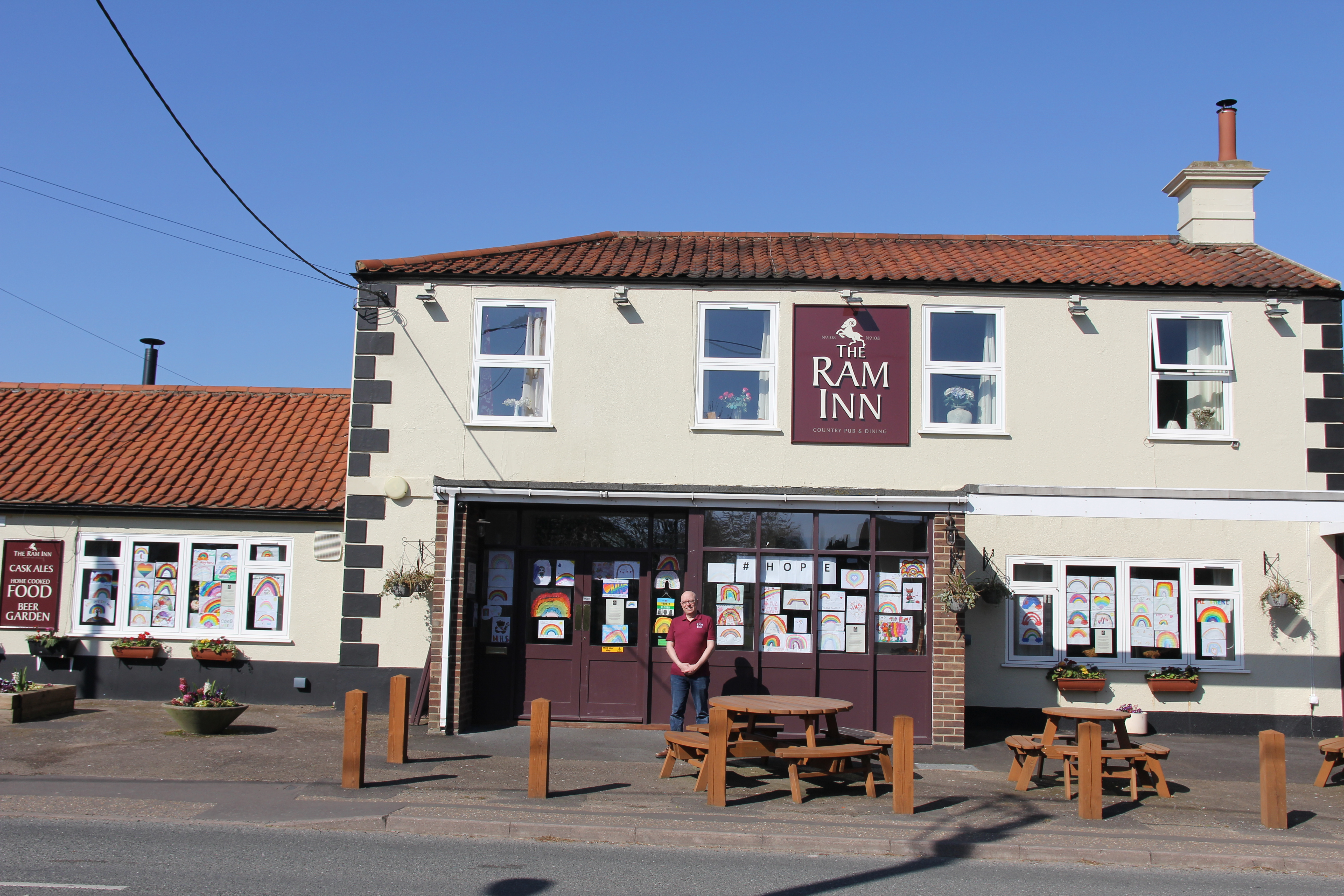 The Ram Inn in Brundall, with pictures of rainbows stuck in the windows