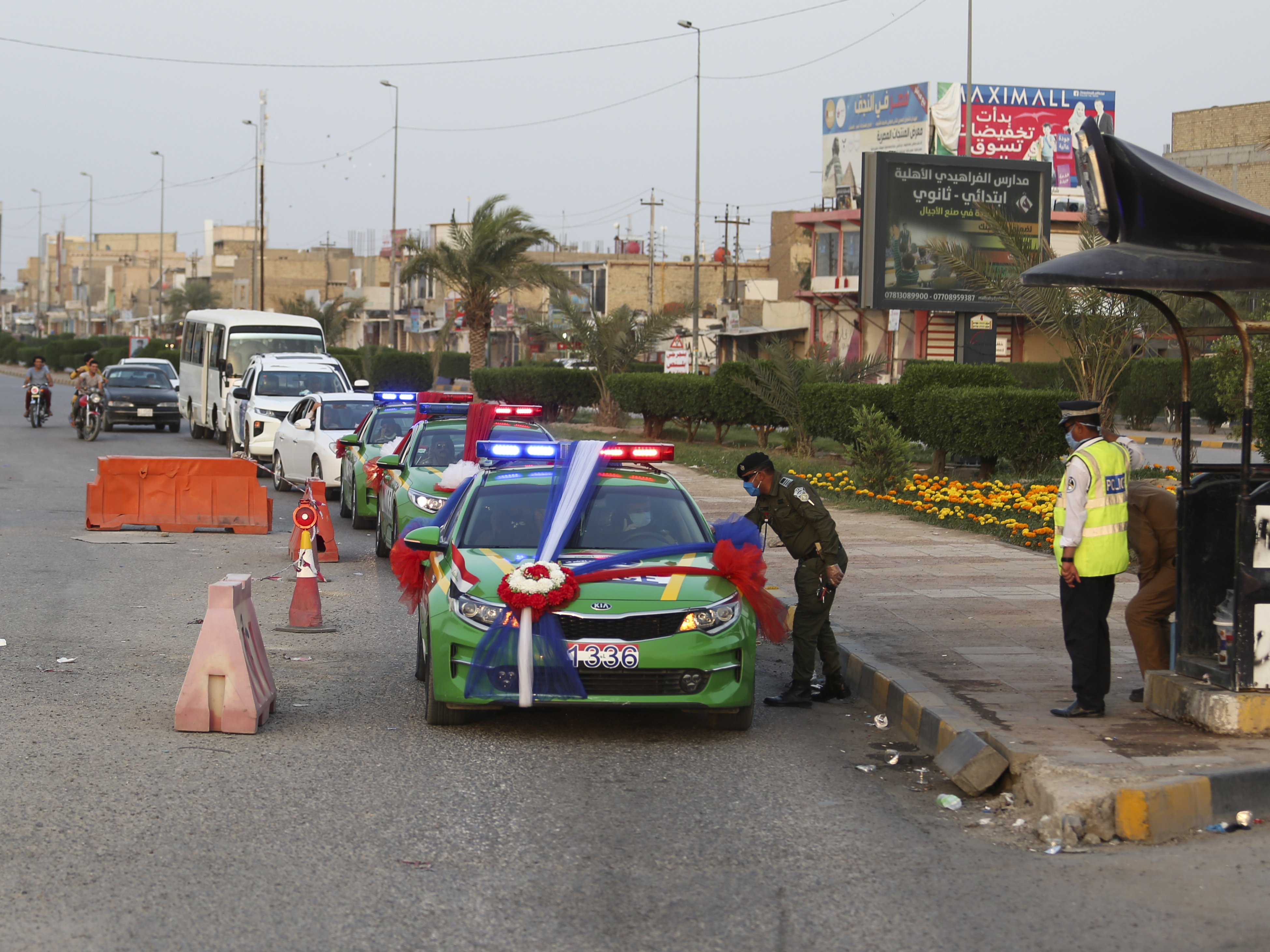 Police cars transported the wedding party 