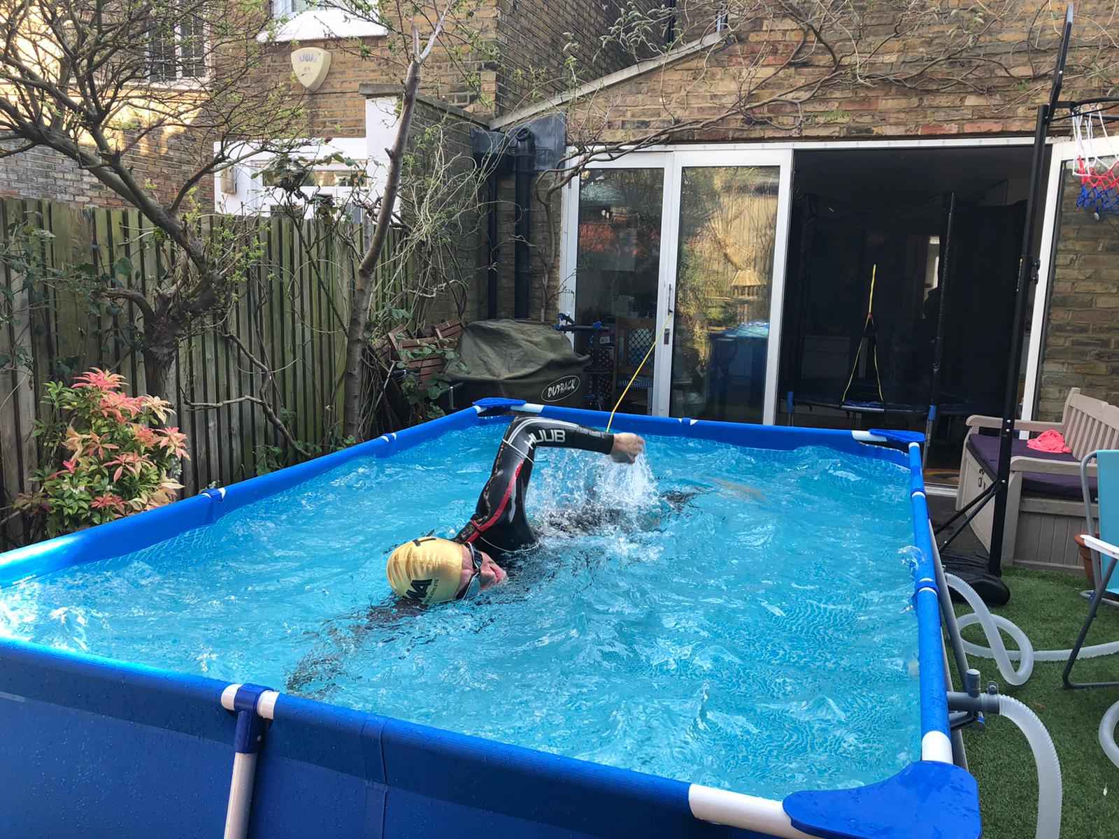 Neil Clark swins in a three-metre swimming pool