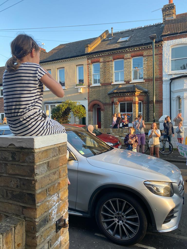 Neil's neighbours clapped him from the street after he finished his triathlon