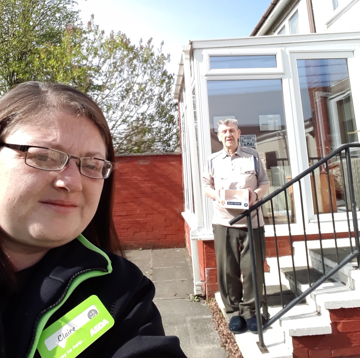 Claire, from Asda, drops off a cake for Ken McGinley