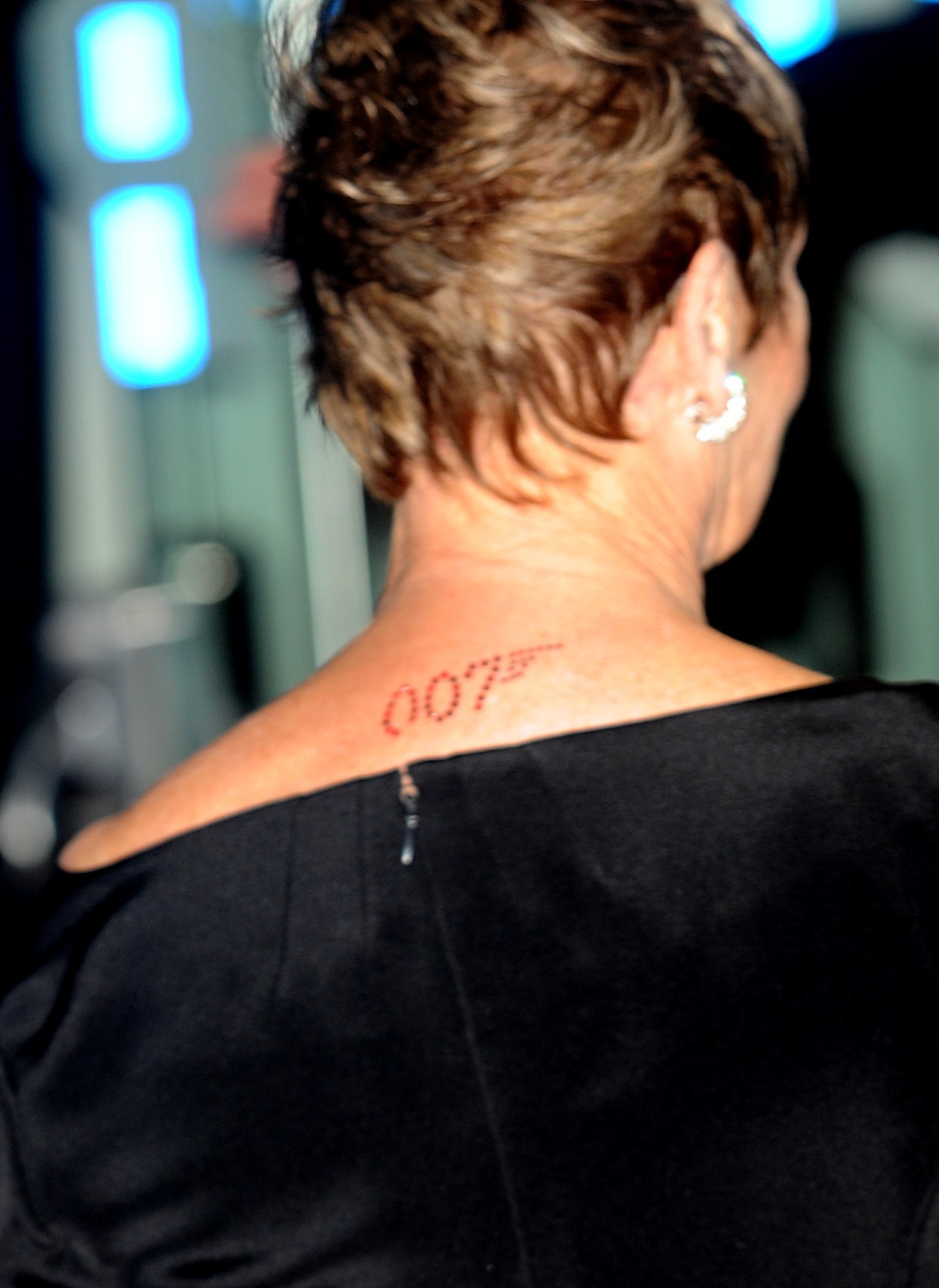 The 007, James Bond logo on the back of Dame Judi Dench's neck as she arrives for the World premiere of 'Quantum Of Solace' at the Odeon Leicester Square, WC2.