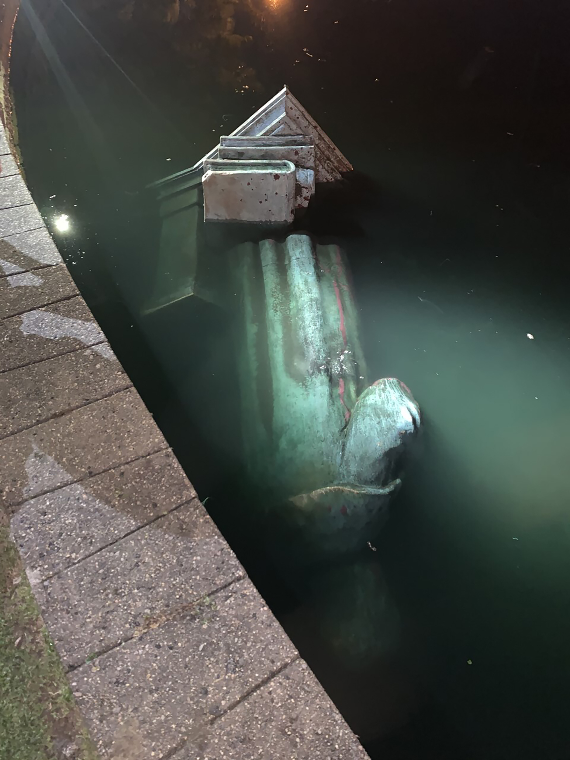 A statue of Christopher Columbus in water