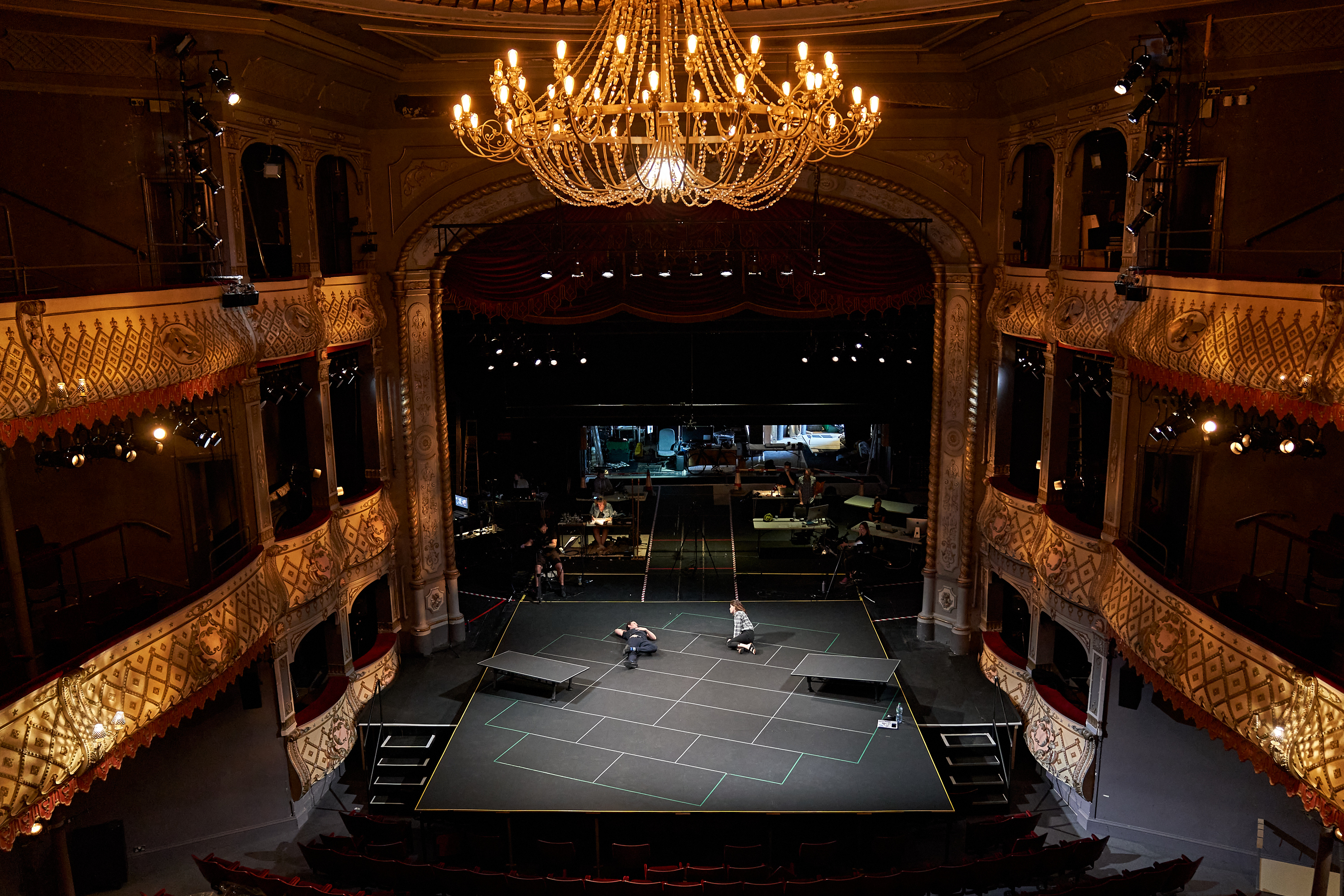 The actors in an empty auditorium