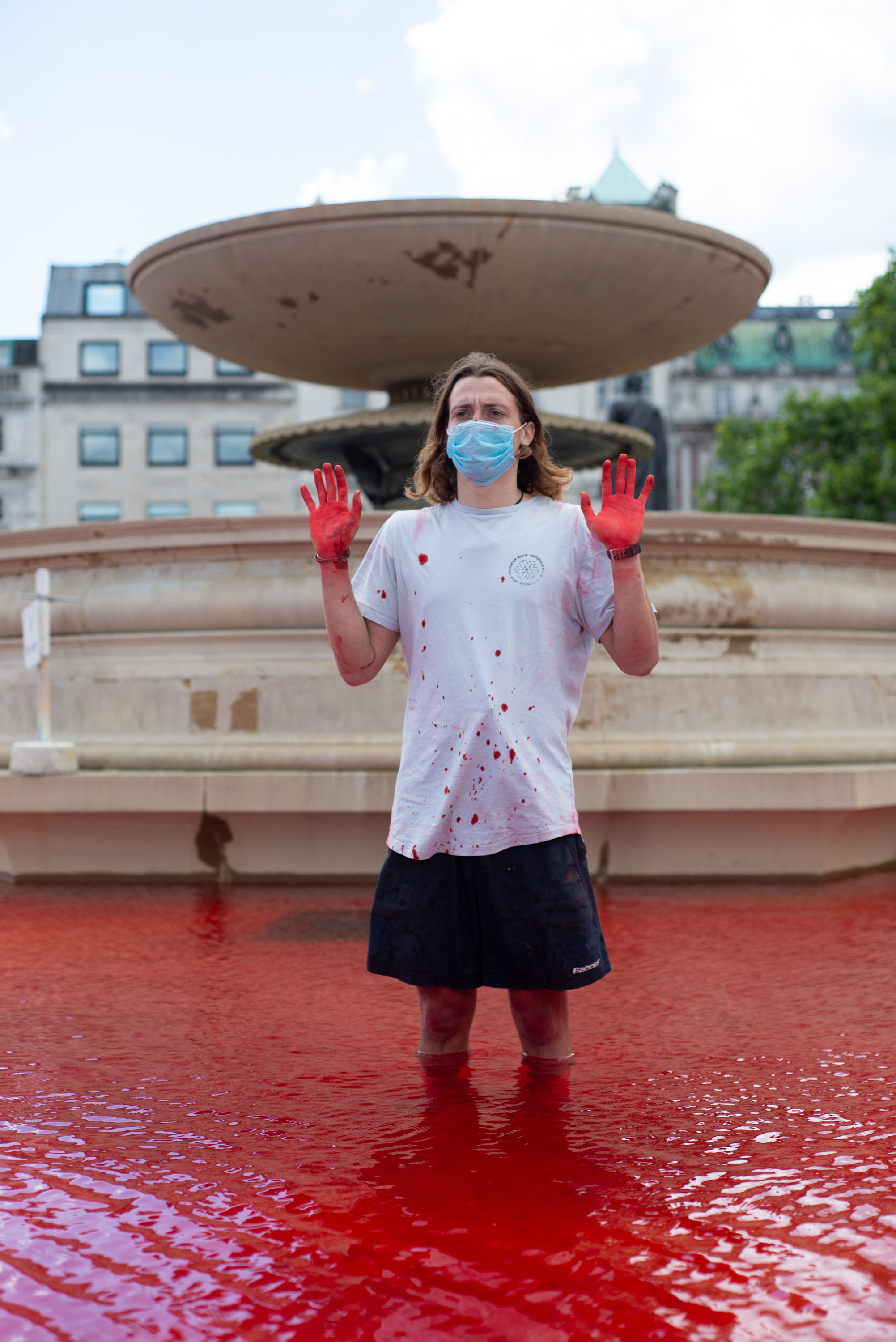 A protester with blood red hands