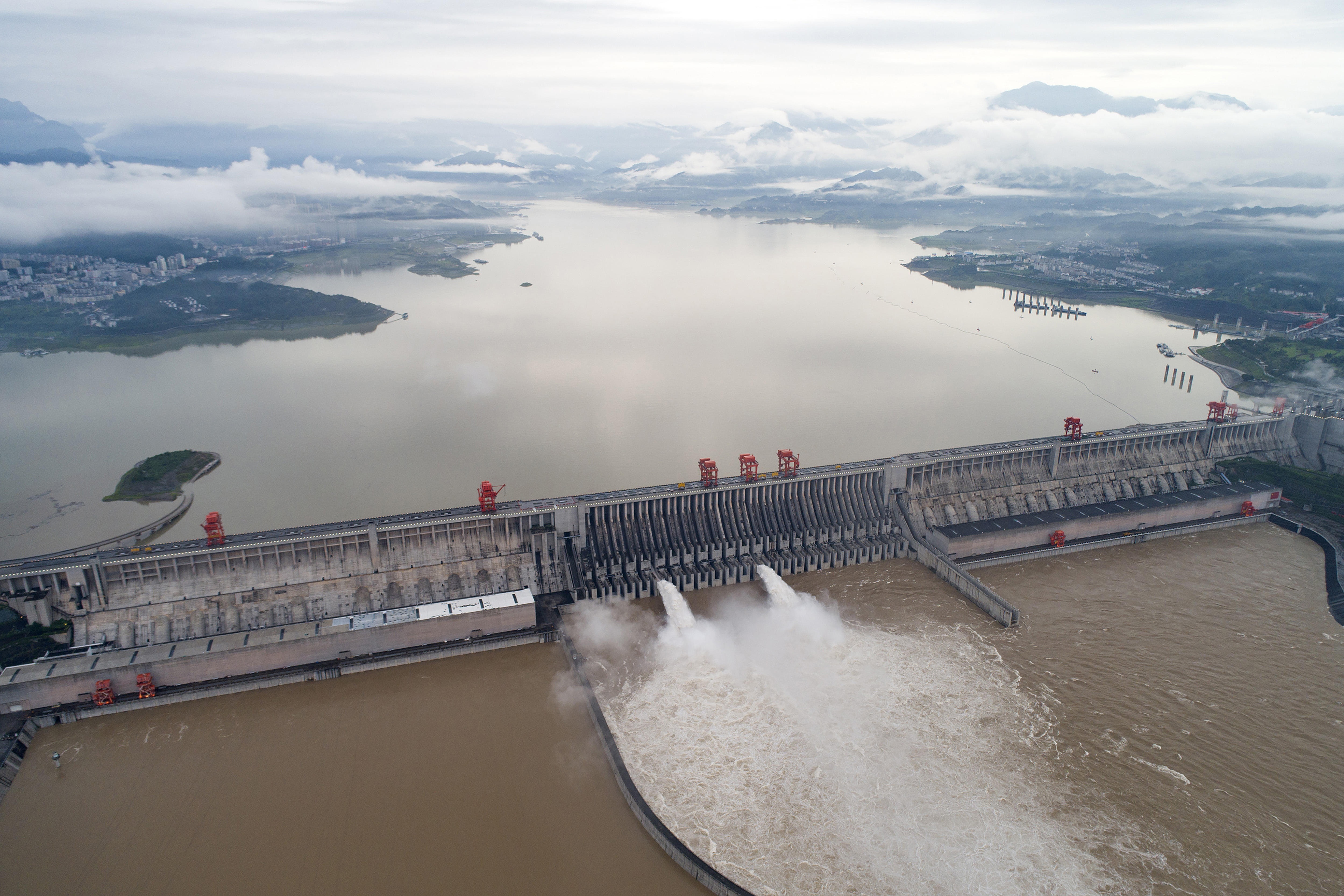 Water flows out from sluiceways at the Three Gorges Dam on the Yangtze River near Yichang in central China's Hubei province
