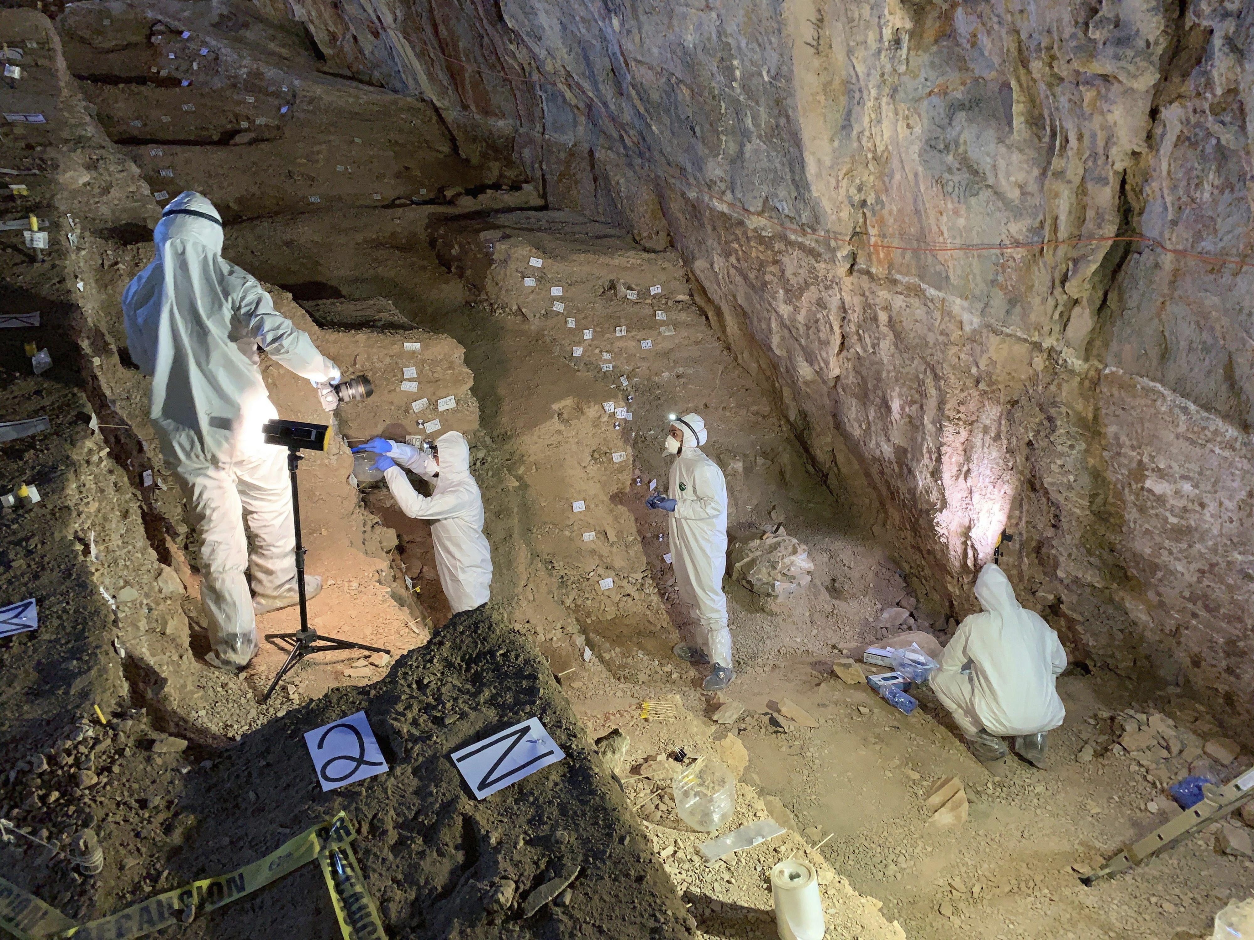 Researchers take samples from different cultural layers in a cave in Zacatecas, central Mexico 