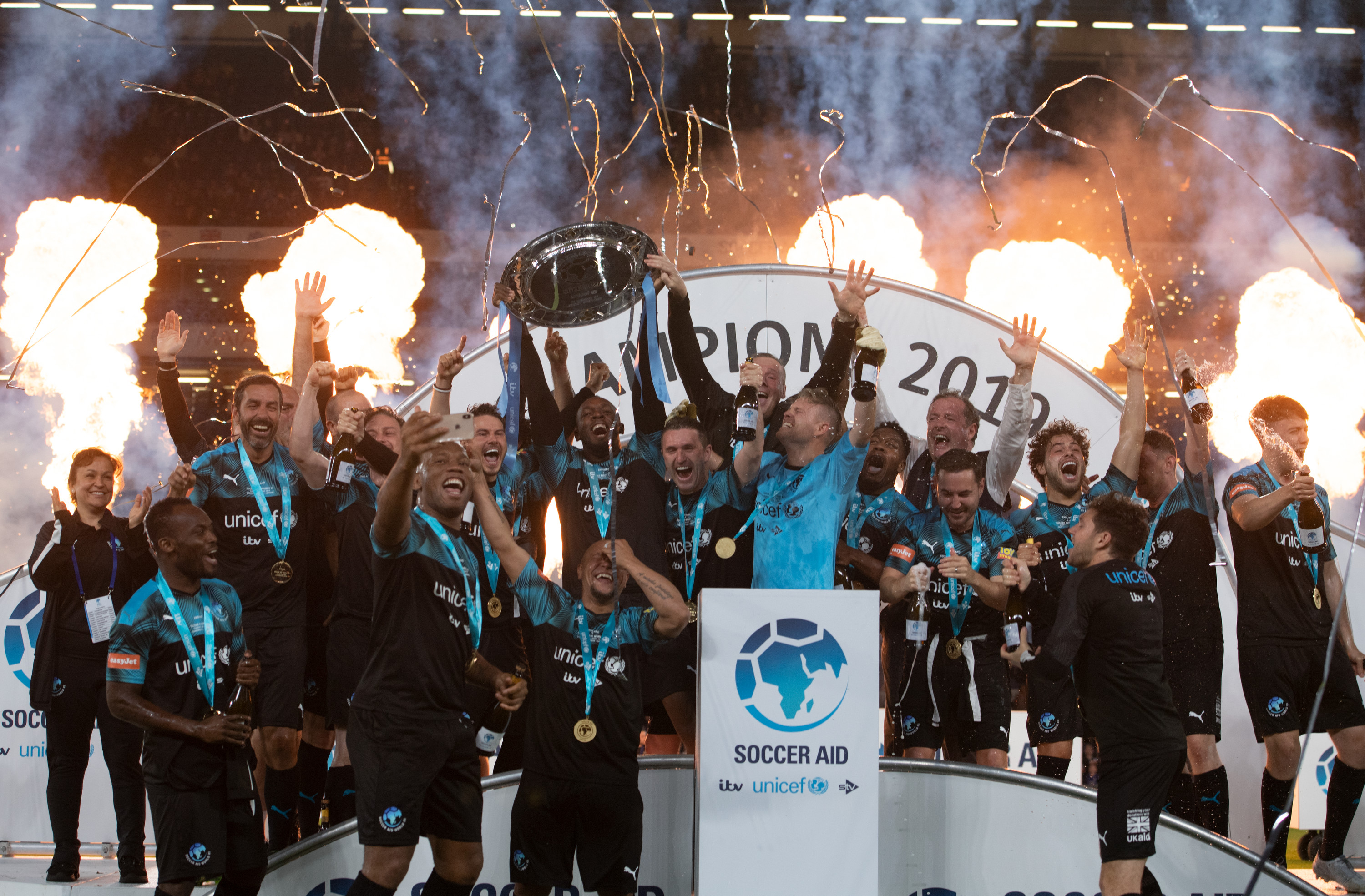 Soccer Aid World XI celebrate winning following the Soccer Aid match at Stamford Bridge last season.
