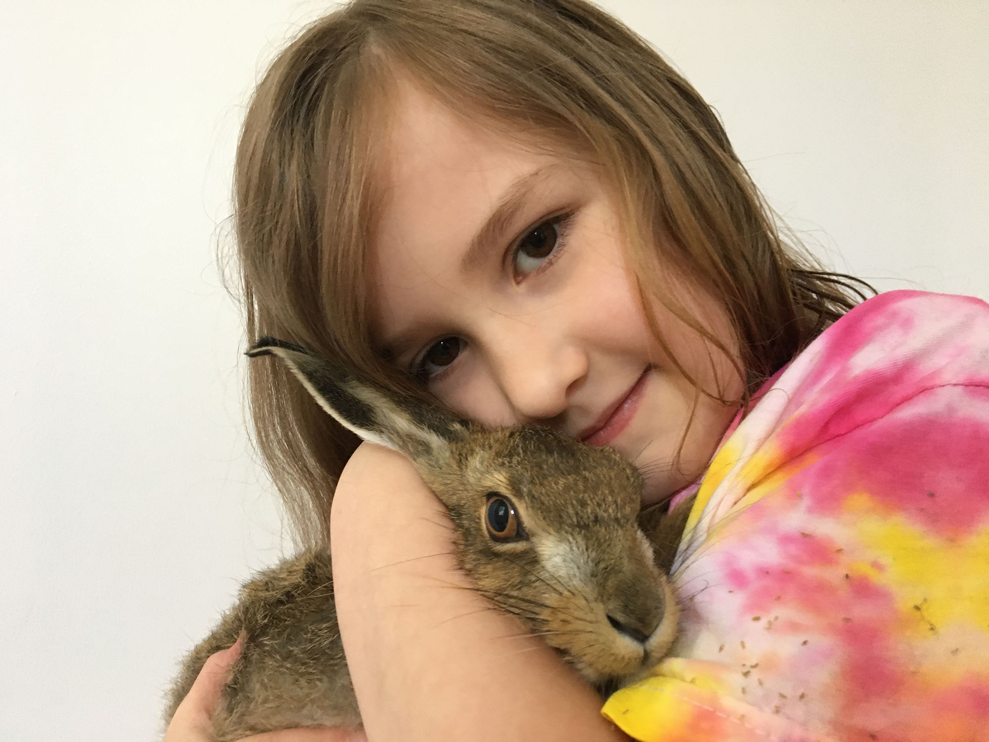Eliza Terry hugging Clover the hare