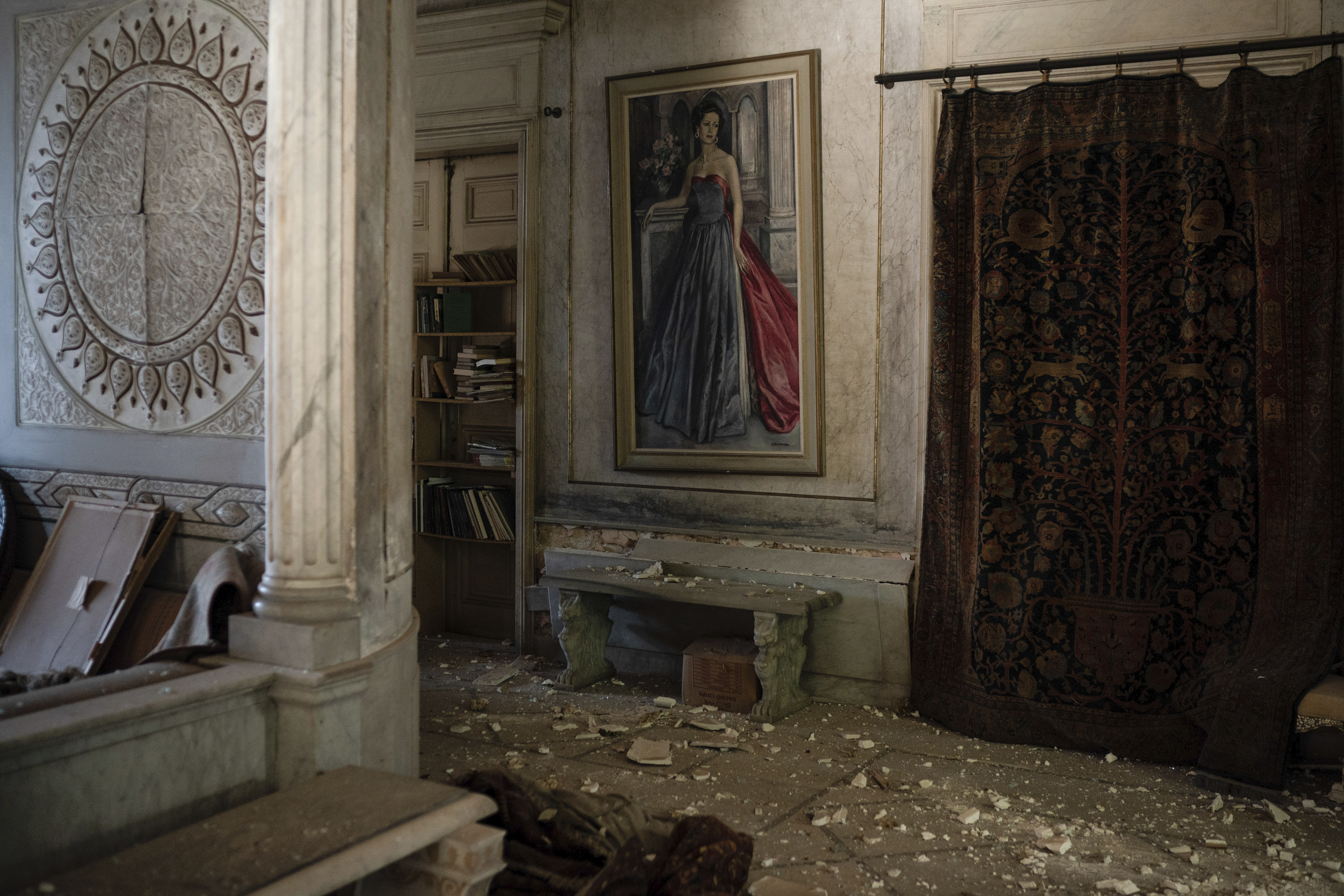 Debris from the ceiling and walls cover the floor of a room in the Sursock Palace, heavily damaged after the explosion in the seaport of Beirut, Lebanon