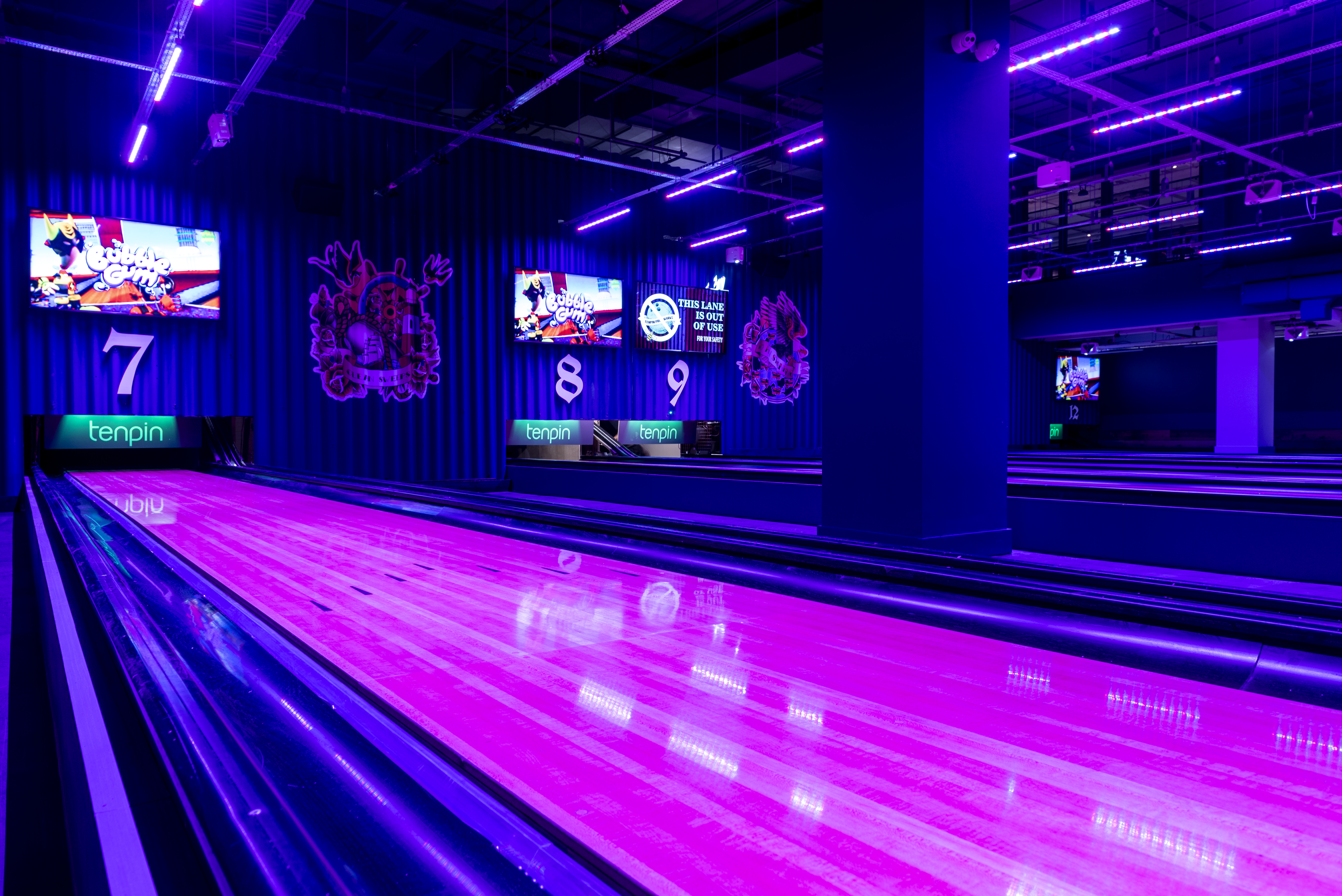 Pink bowling lane and blue walls