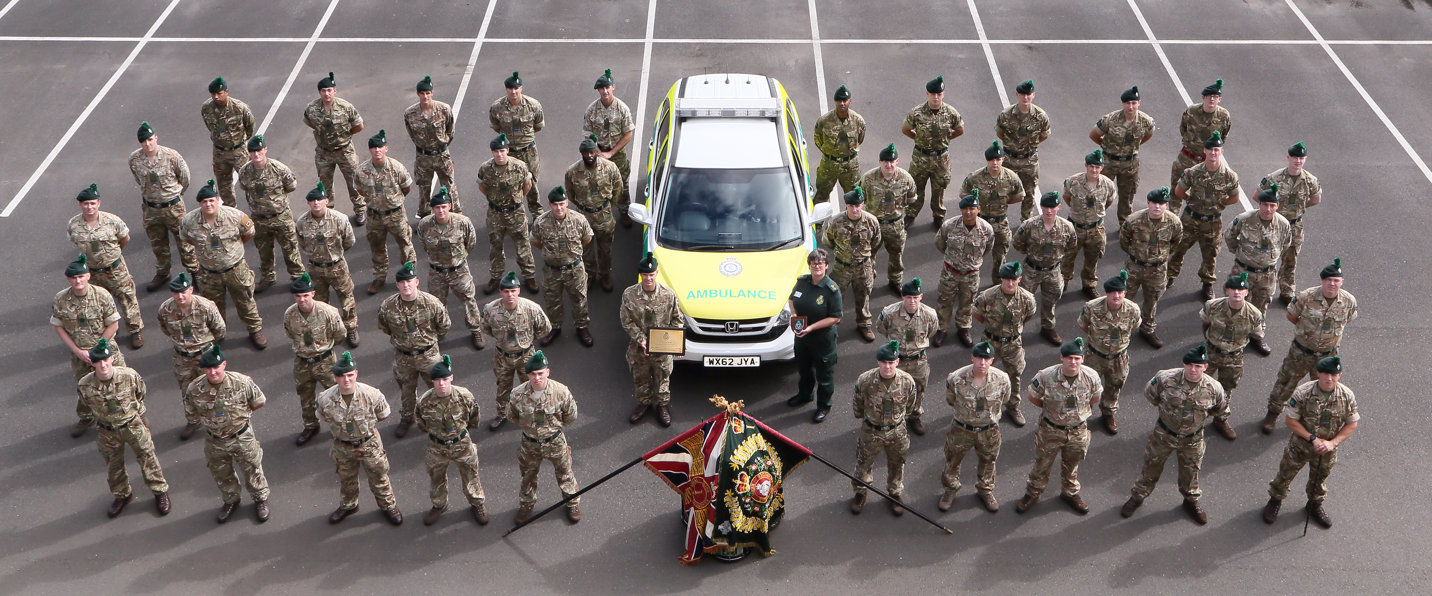 Ambulance Operations Manager Heather Ransom presents a commemorative plaque to the 1st Battalion Royal Irish Regiment at Shropshire’s Clive Barracks