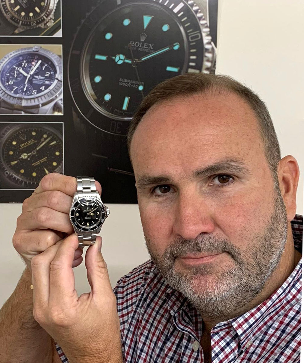 Auctioneer David Hare with the former miner's Rolex watch (Gardiner Houlgate/PA)