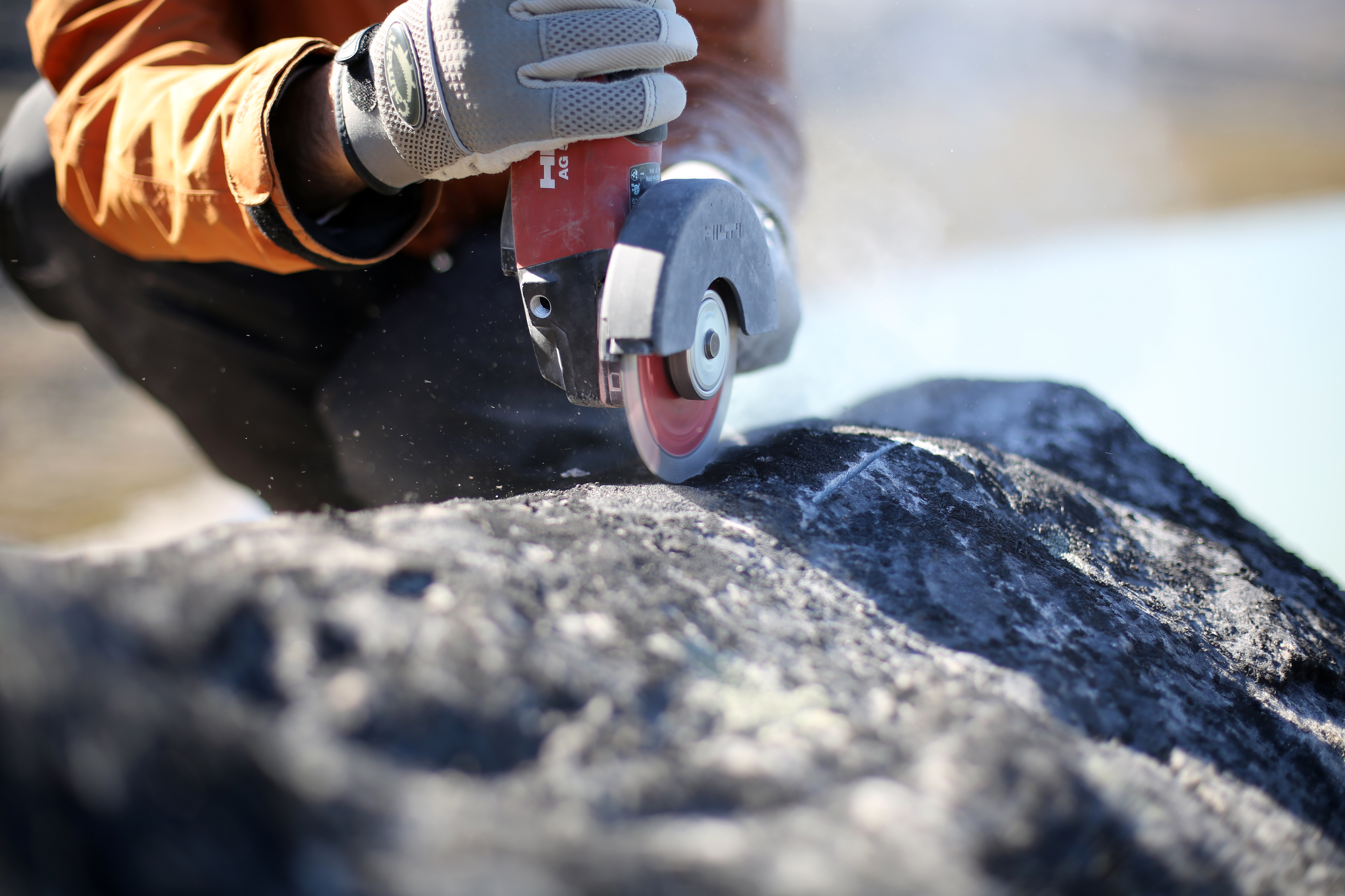Scientists collecting samples from boulders in Greenland