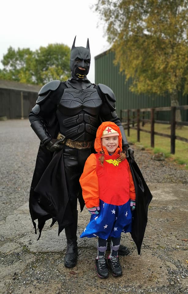 Carmela was greeted on the finishing line by Batman (Muscular Dystrophy UK/PA).