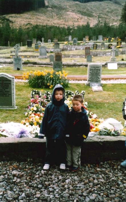 Andrew and his brother at the graveside