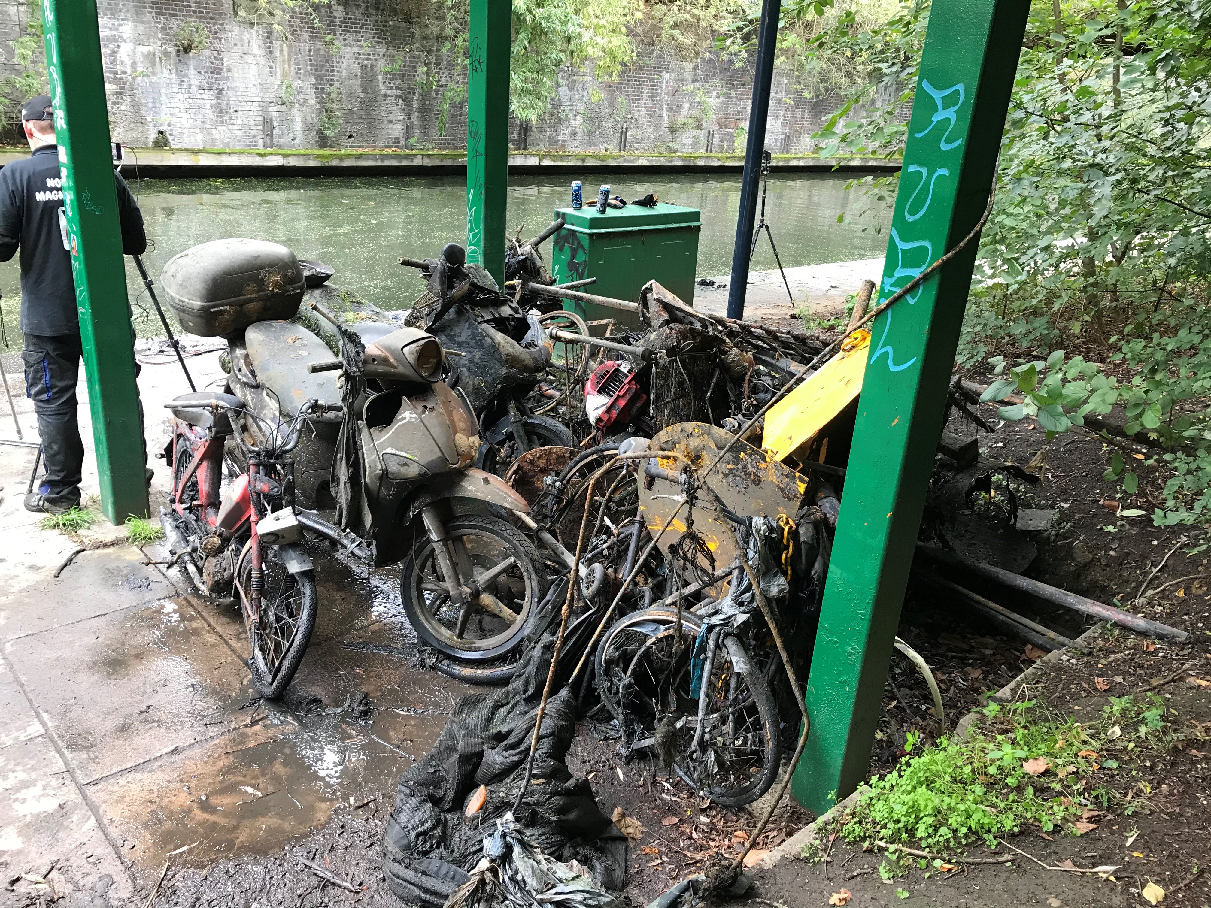 Magnet fishers pull shrapnel including three motorbikes, five pushbikes, a penknife and gold jewellery from Regent's Canal in London on Sunday October 11, 2020 (Laura Parnaby/PA).