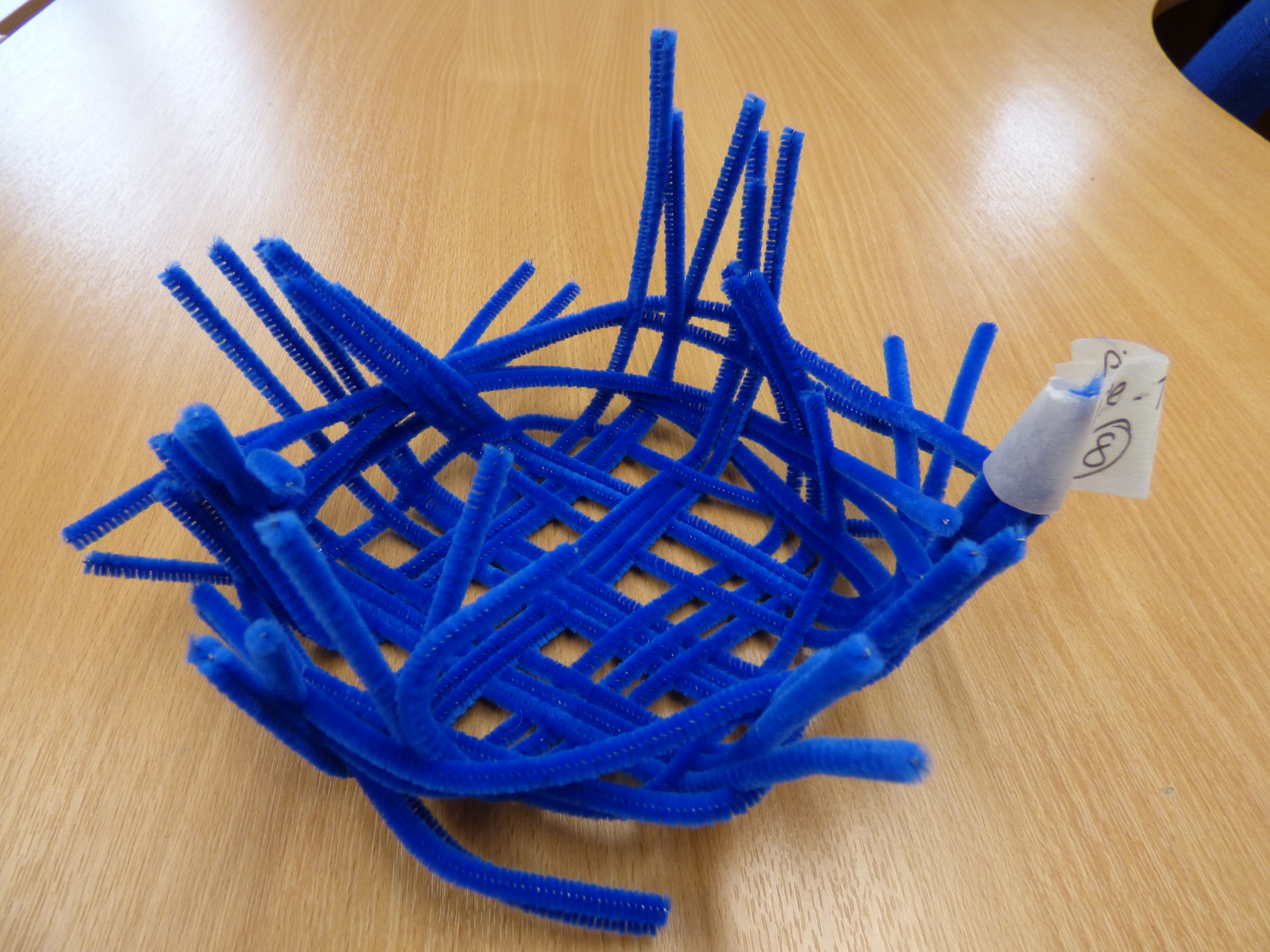 A basket made of pipe cleaners