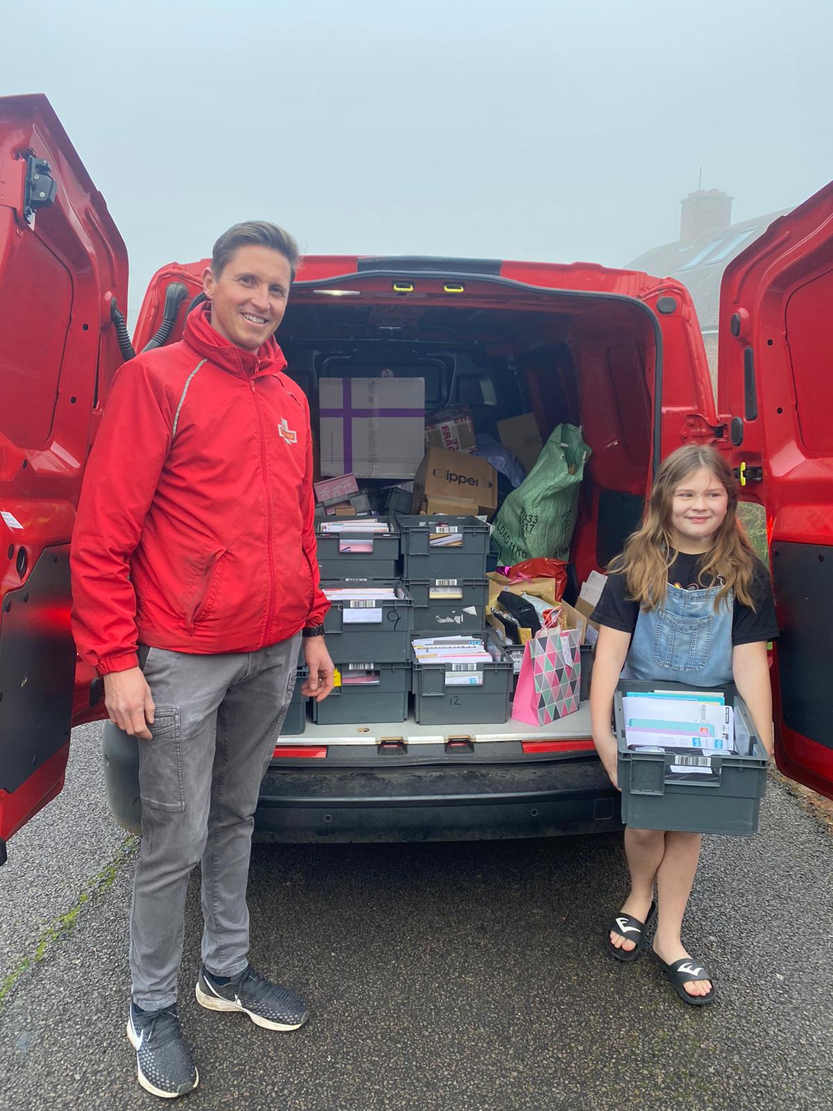 Abbie Paice and a postman with her special birthday delivery