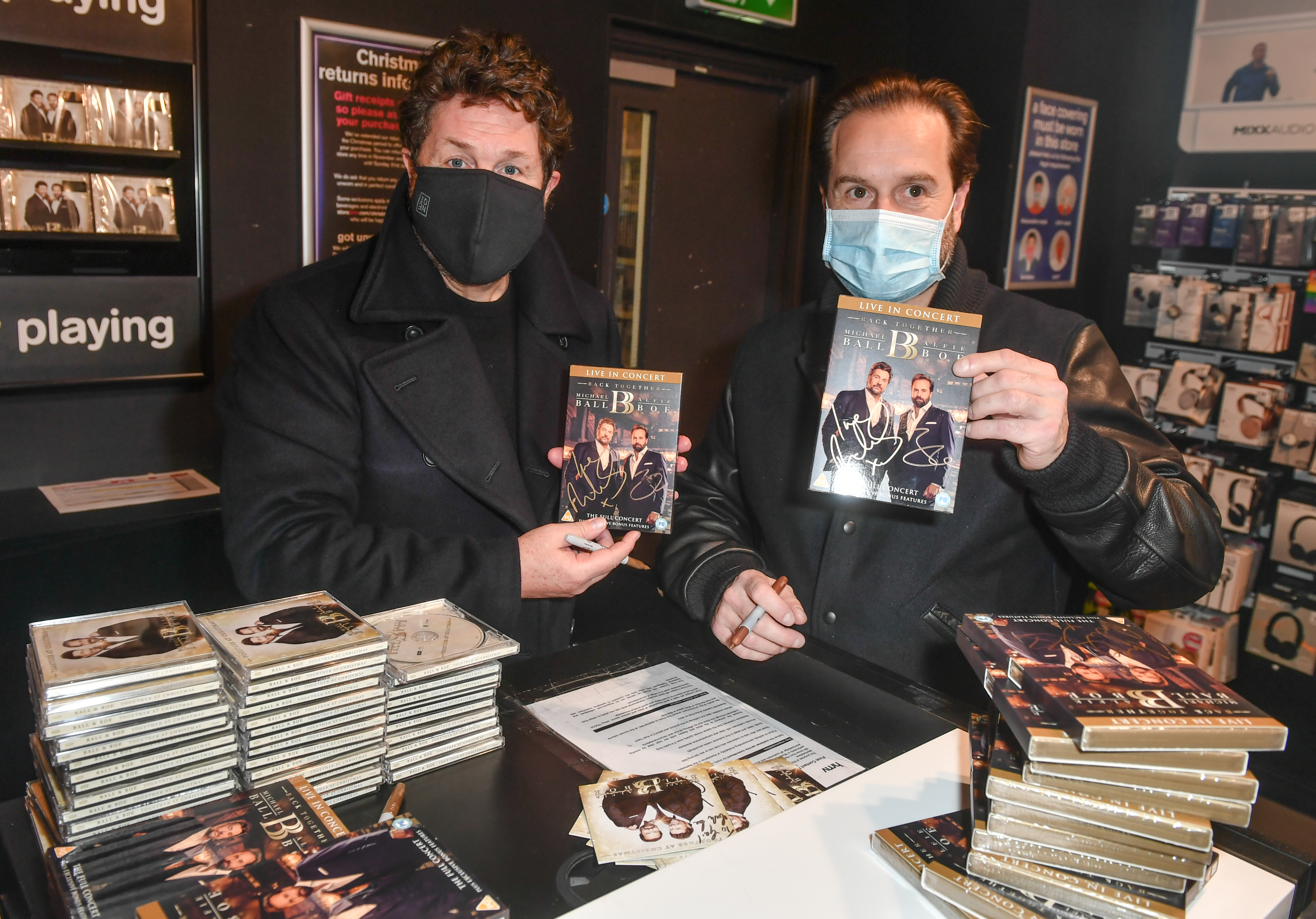 Michael Ball and Alfie Boe signing copies of their new album