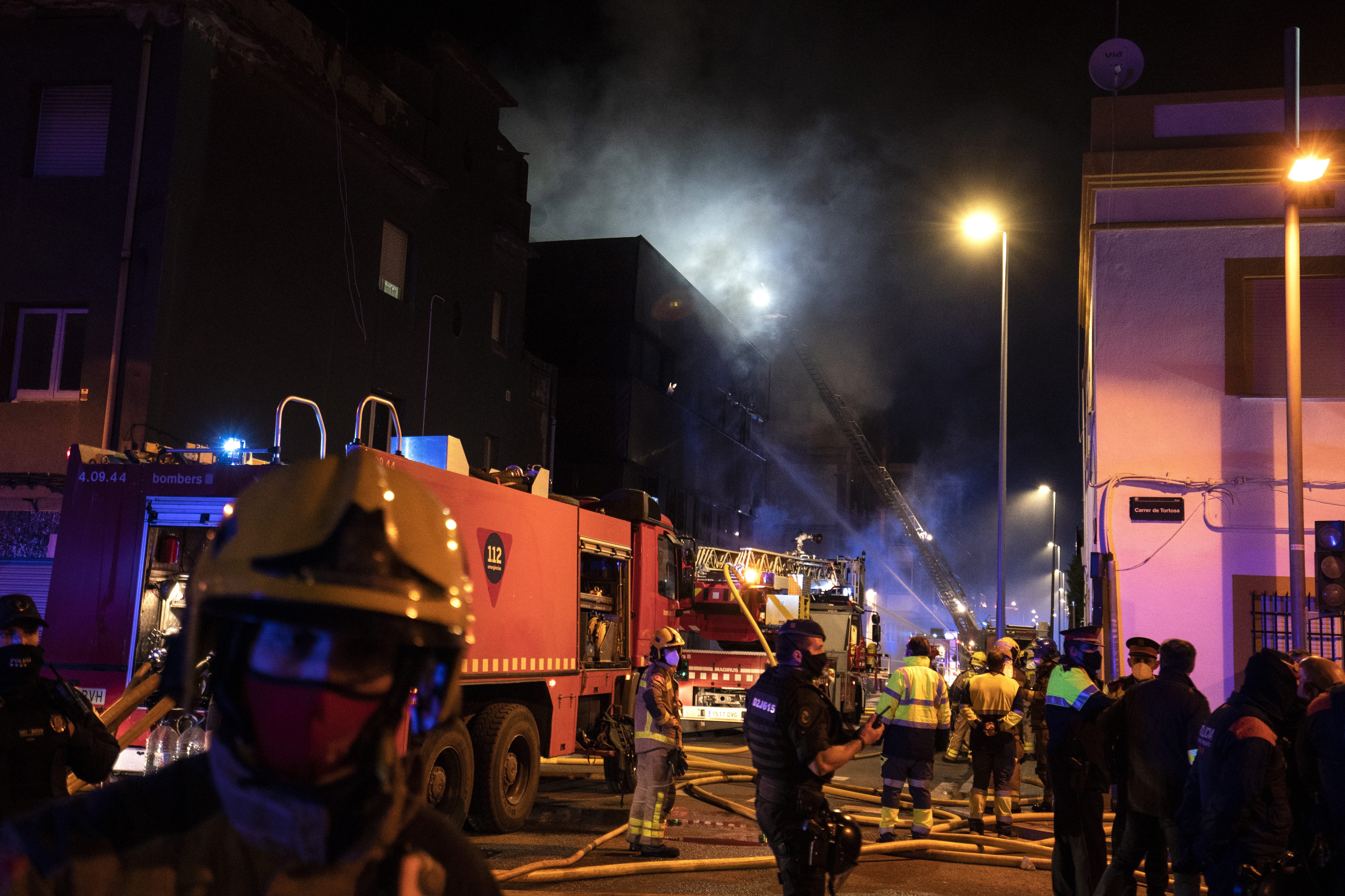 Firefighters work to extinguish the fire