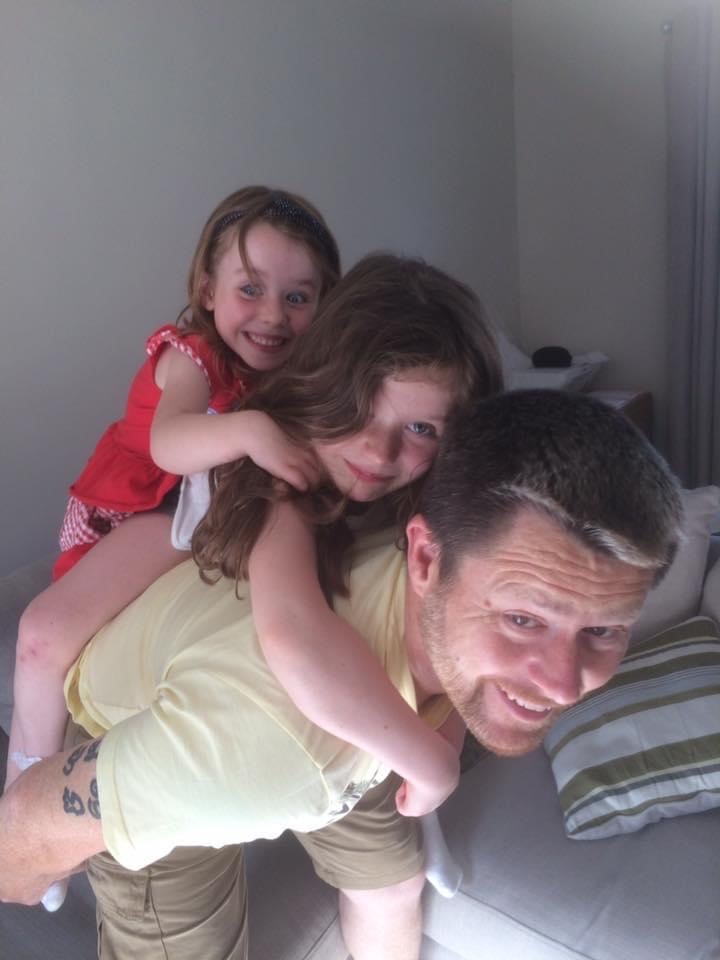 Matt Horsburgh with his two daughters Isabelle (left) and Charlotte (middle). (Cancer Research UK/ PA)