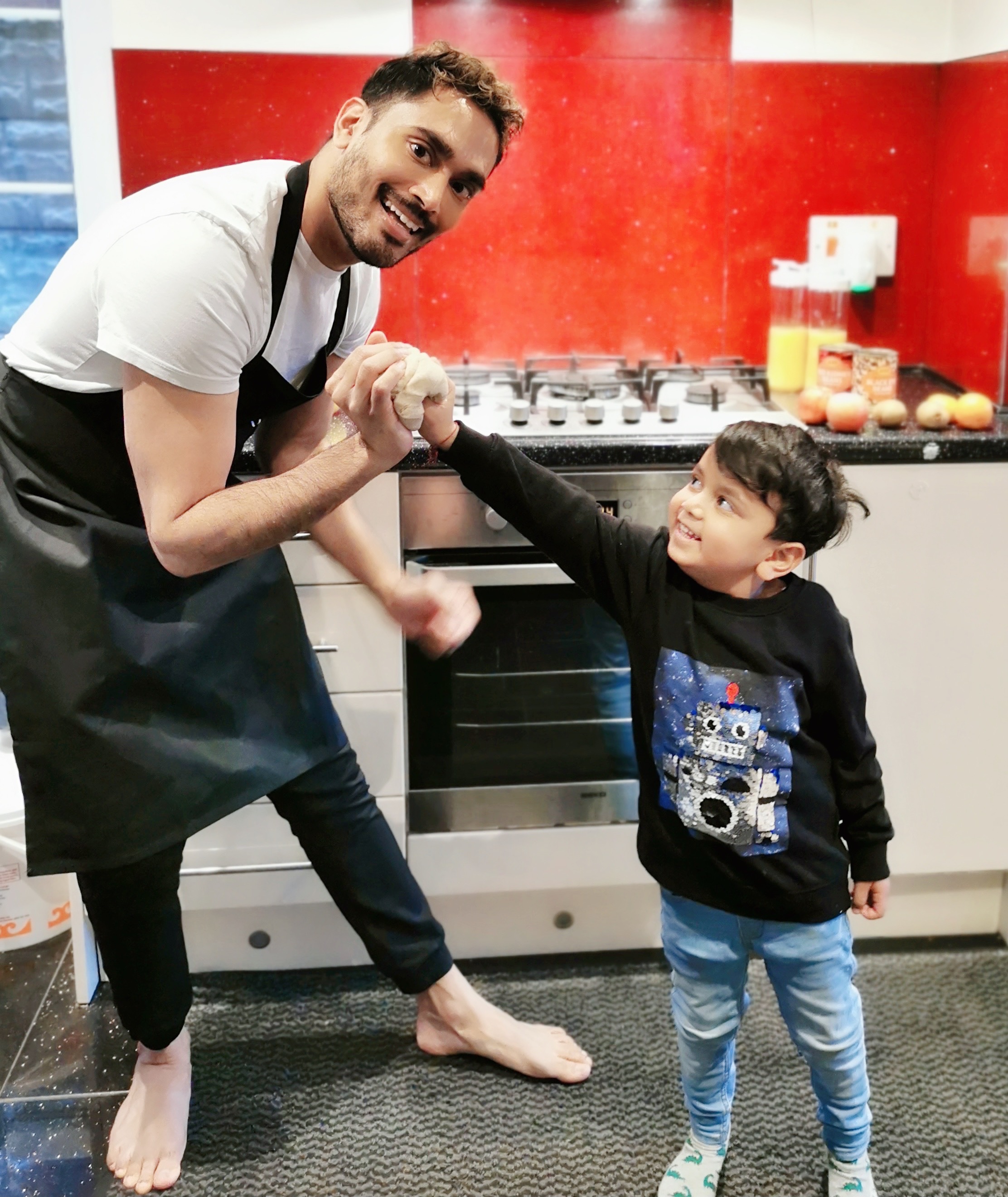 Dr Sunni and his nephew shadow boxing the dough