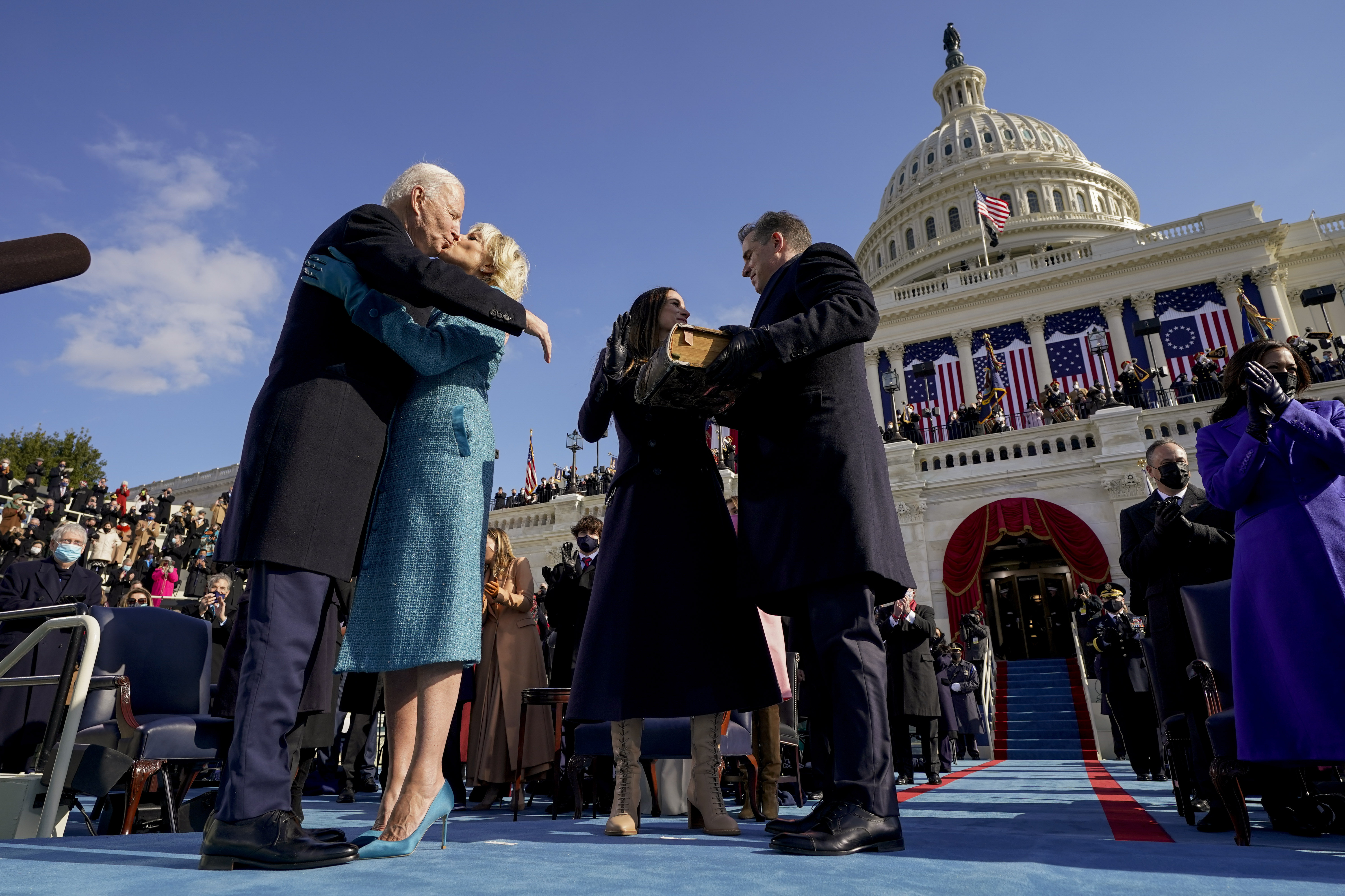 President Joe Biden kisses first lady Jill Biden, as his son Hunter Biden and daughter Ashley Biden, look on after being sworn in during the 59th presidential inauguration at the US Capitol in Washington 