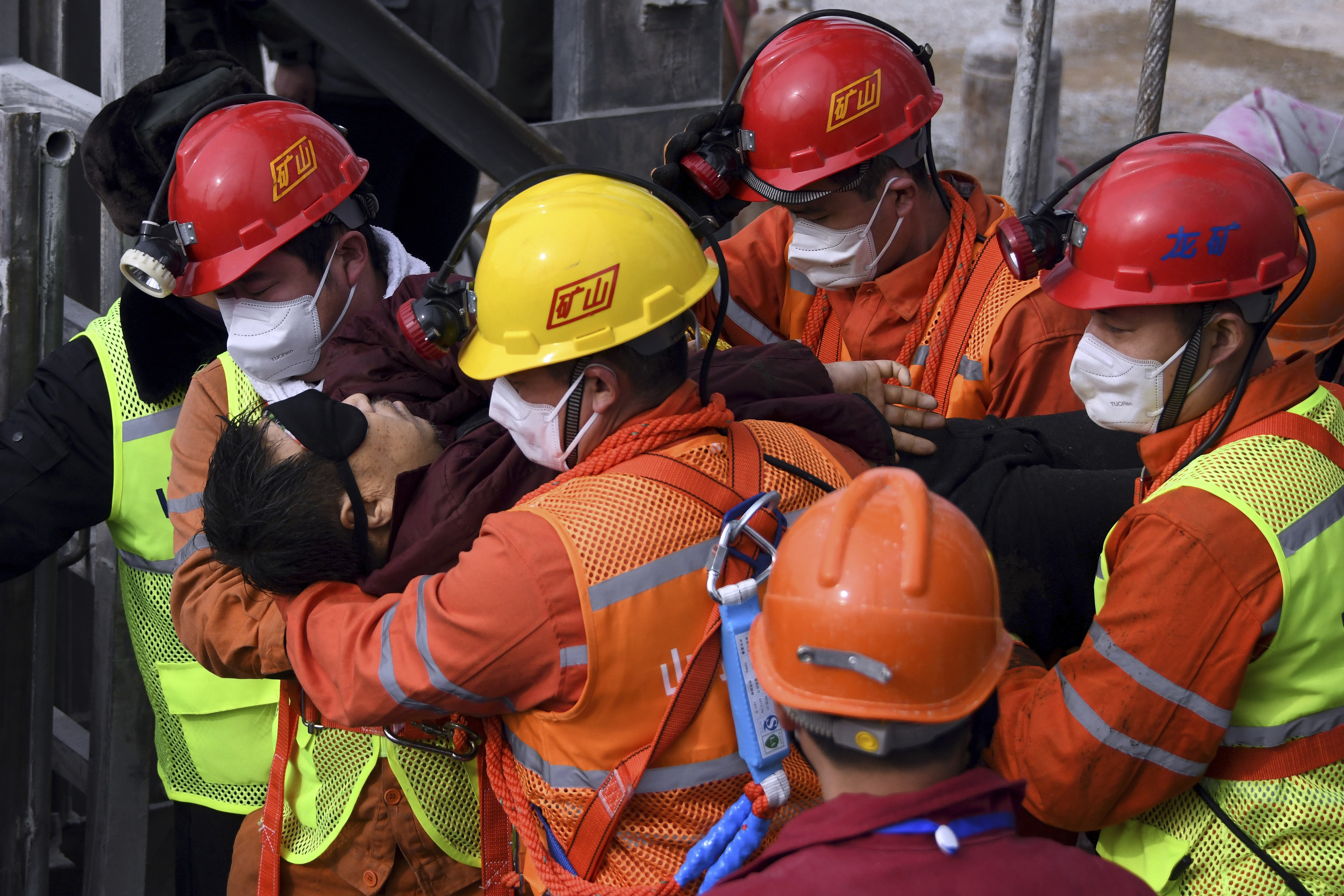 Eleven workers who were trapped for two weeks were brought safely