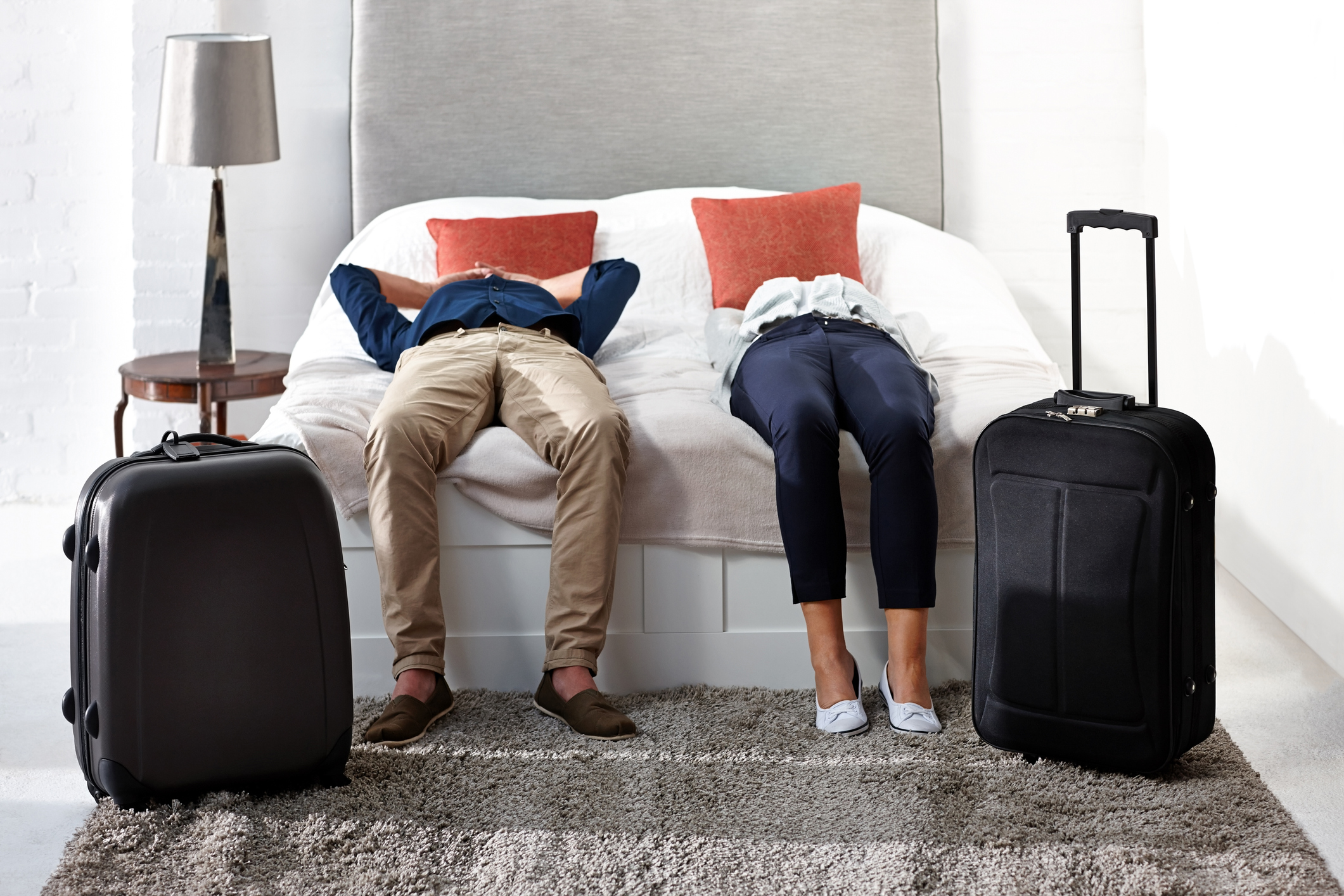 Couple lying on a hotel bed