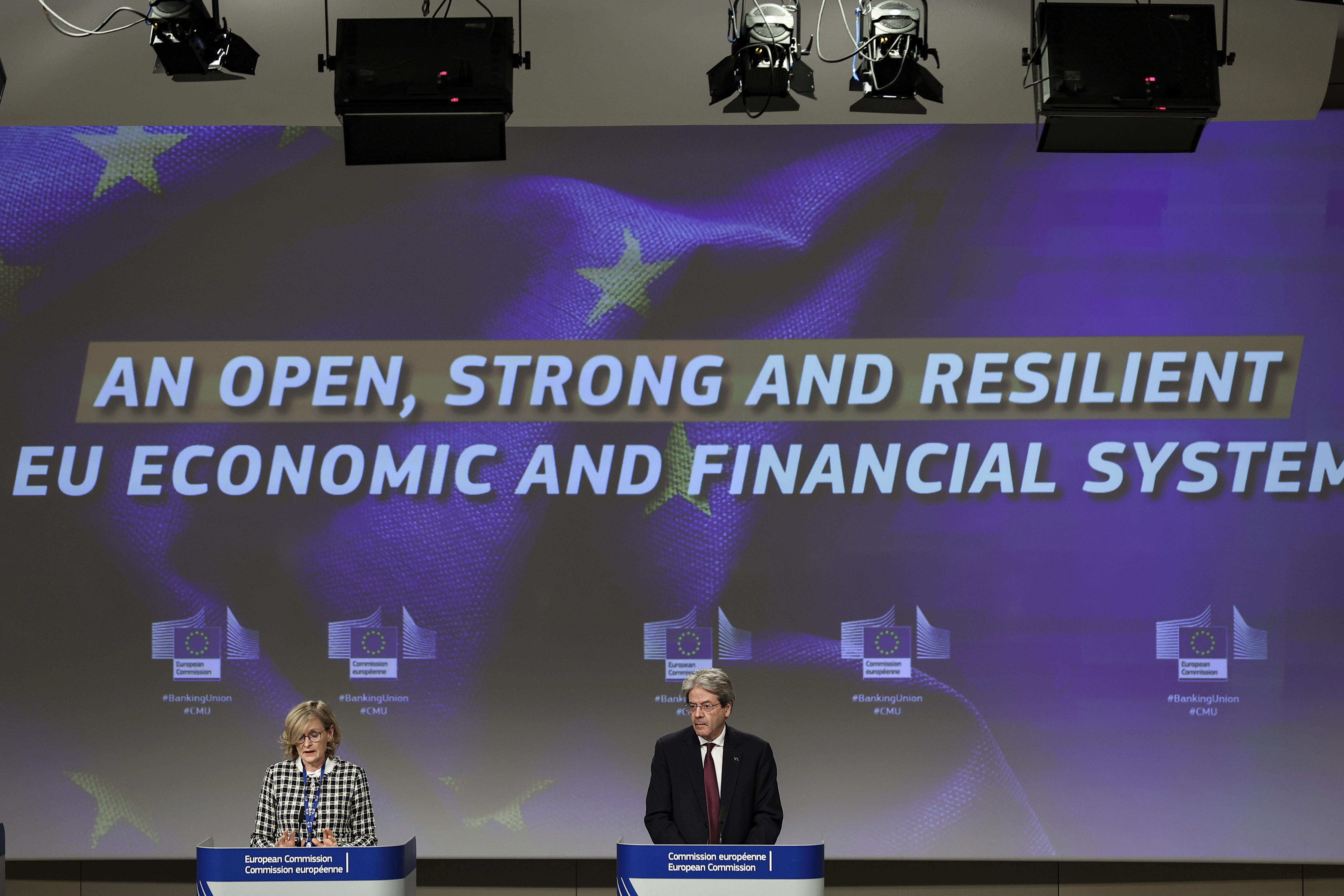 Commissioners Mairead McGuinness, left, and Paolo Gentiloni speak during an online news conference 