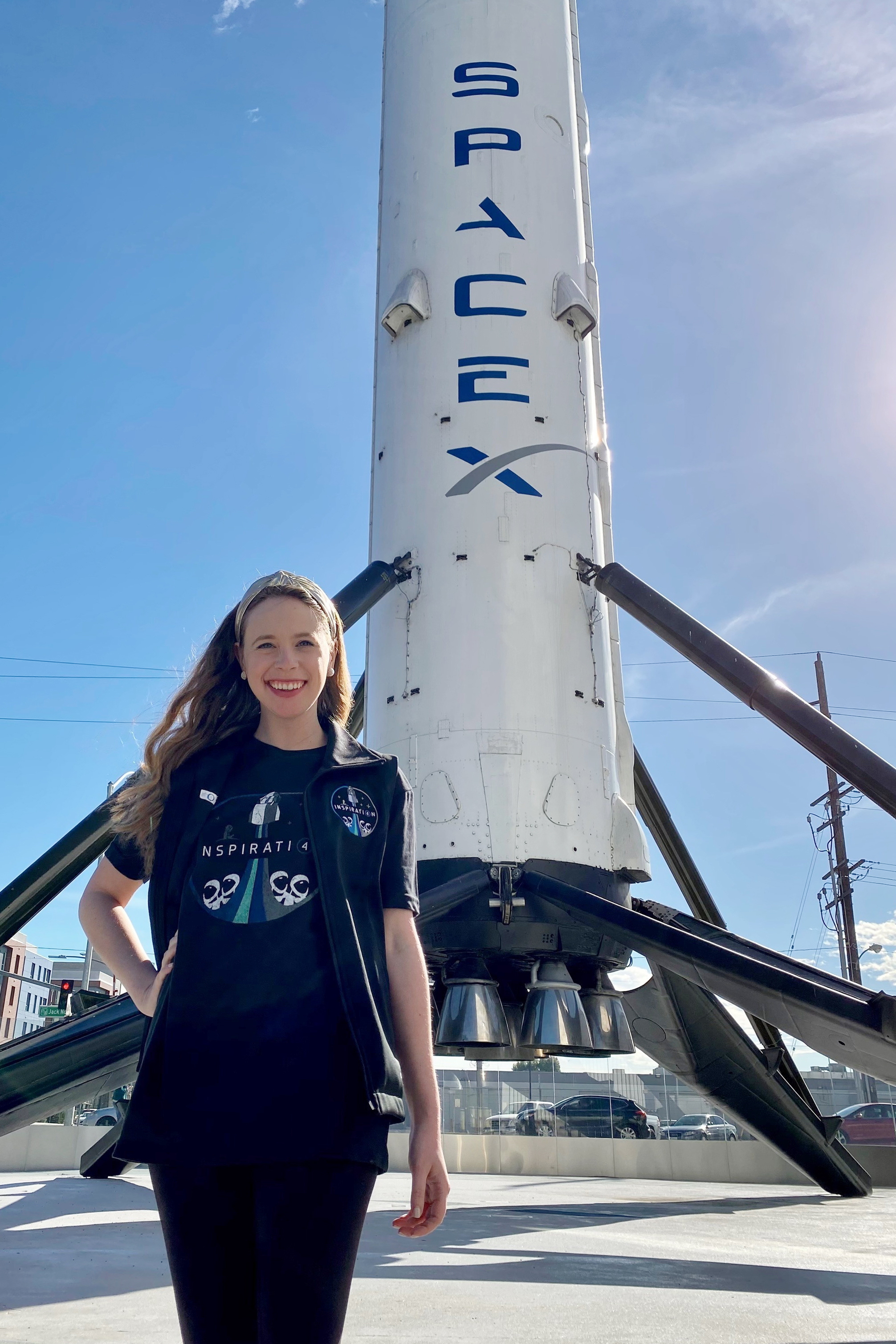 Hayley Arceneaux stands near a SpaceX rocket