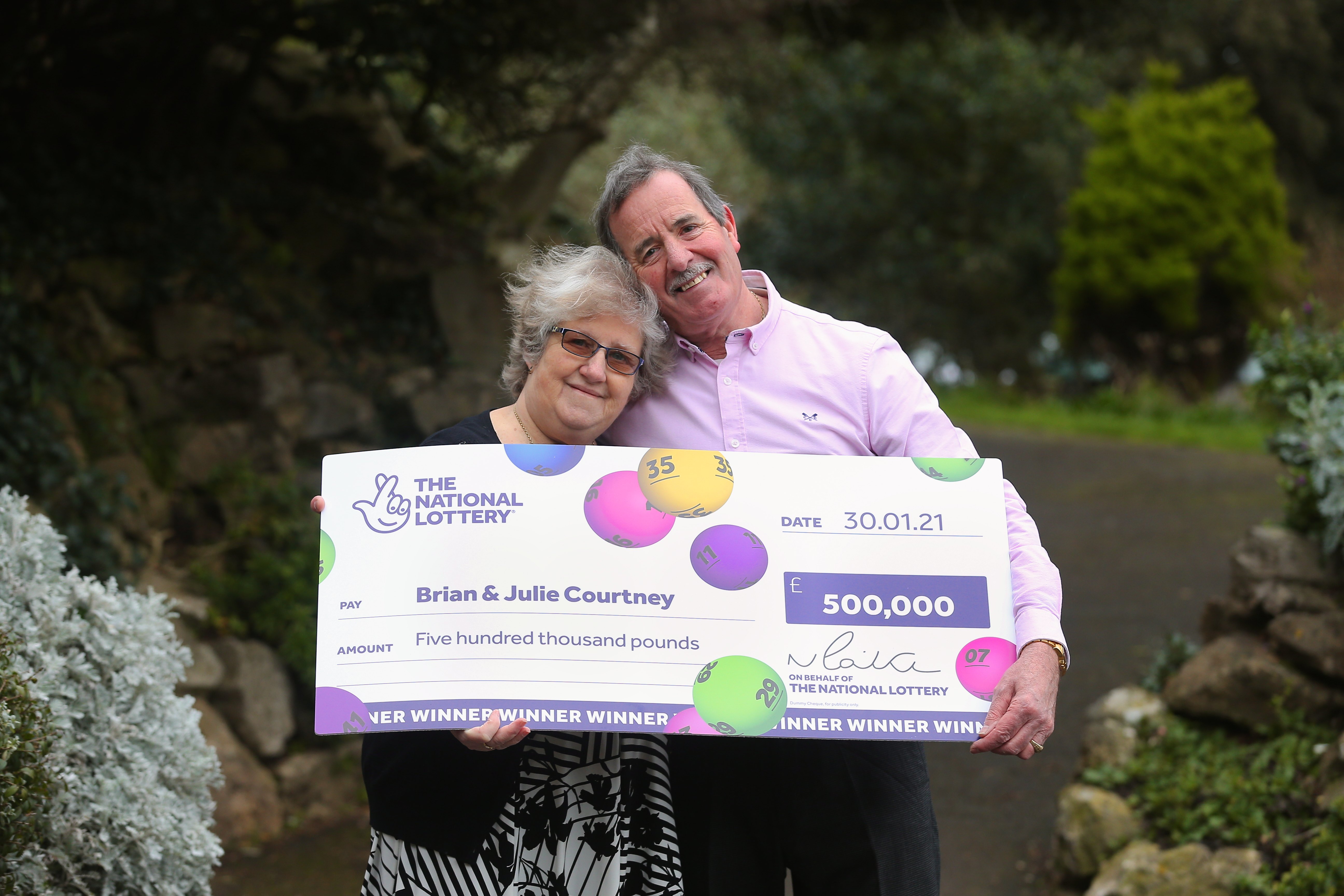 National Lottery Winners Brian and Julie Courtney of Weston Super Mare, Somerset, UK celebrate their £500,000 win