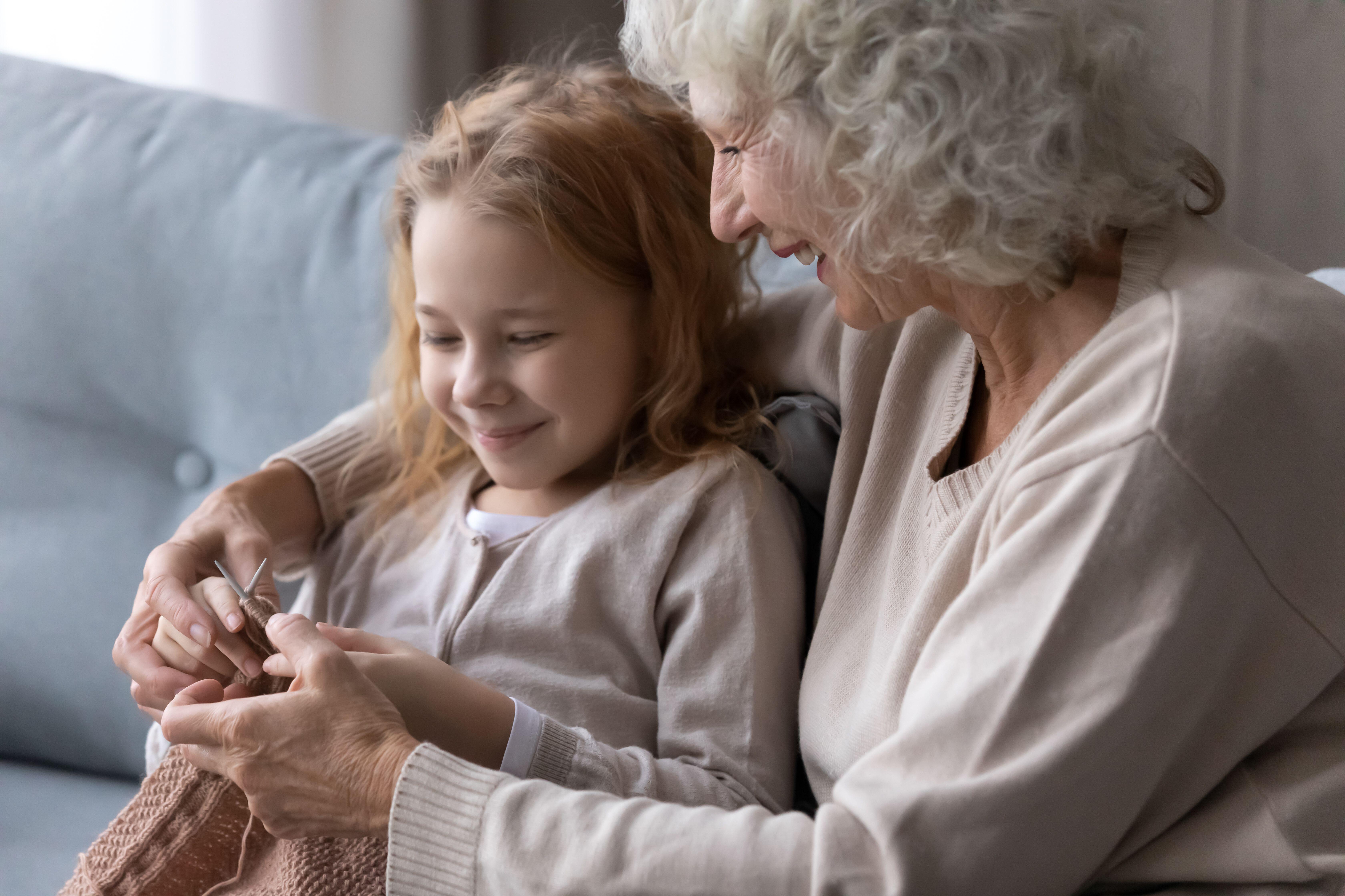 Grandma knitting with granddaughter