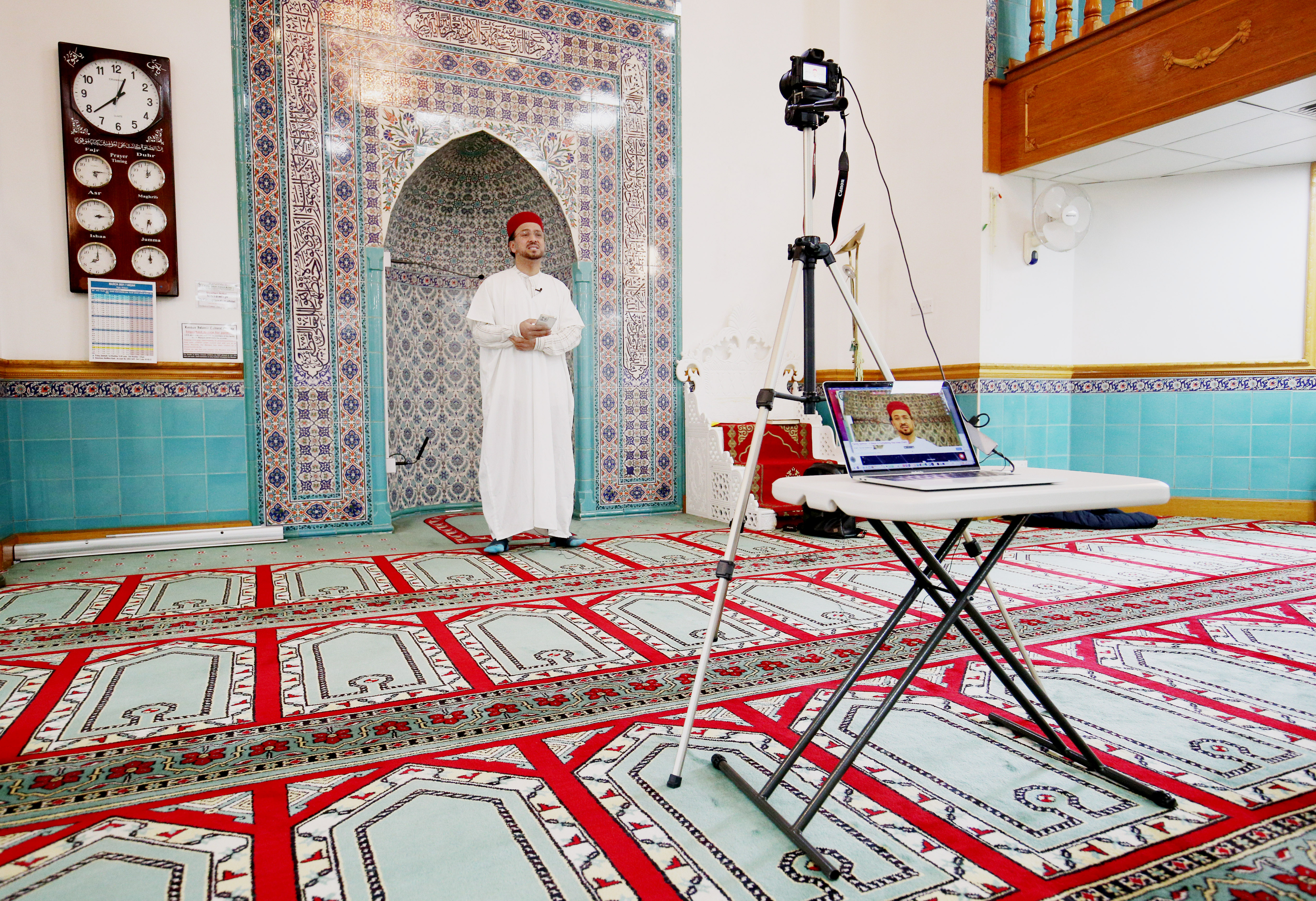 Imam Ajmal Masroor delivers a sermon online from a London mosque (Jonathan Brady/PA)