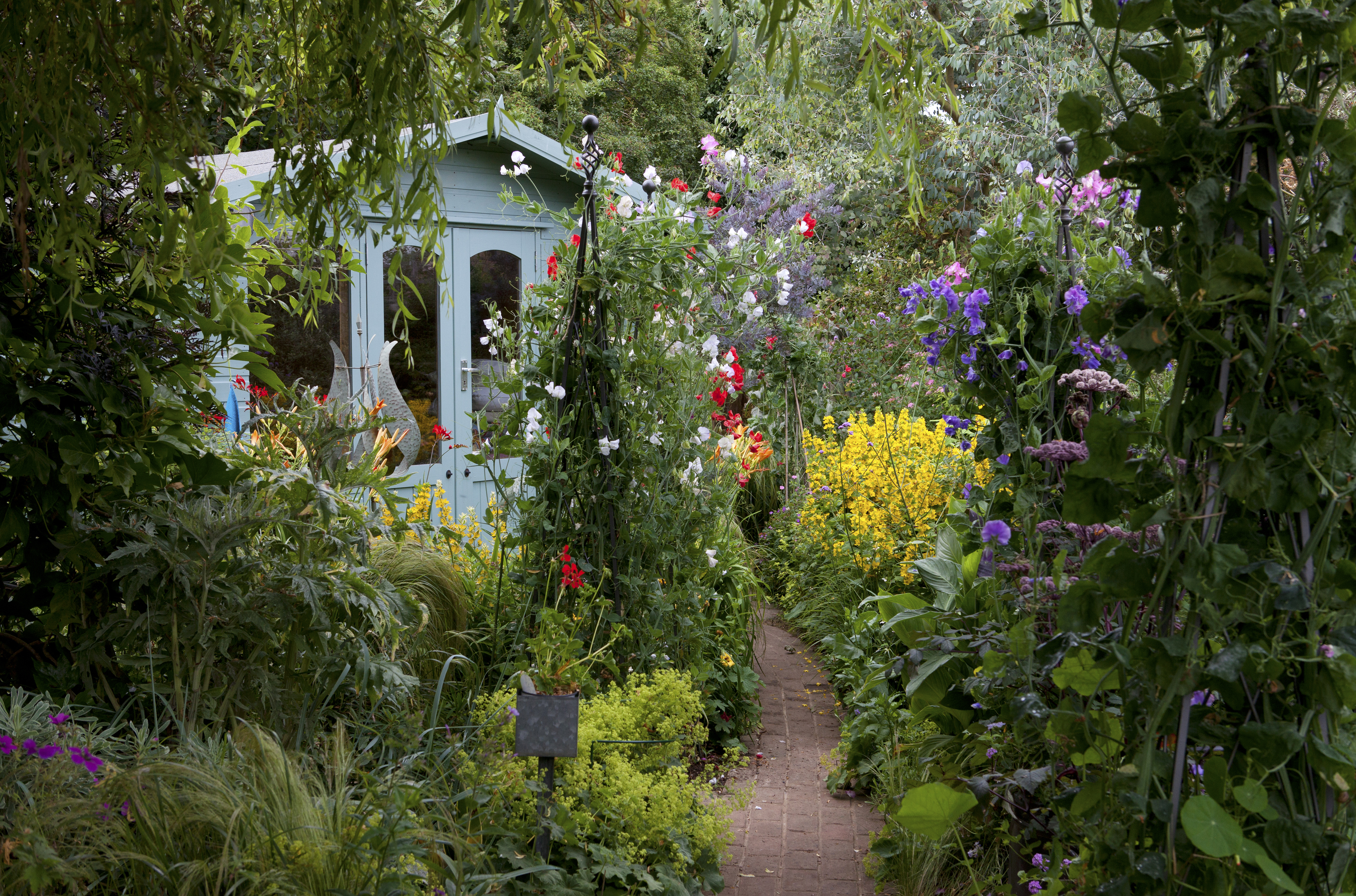 Cupani Gardens, narrow garden with pathway to summer house (Leigh Clapp/PA)