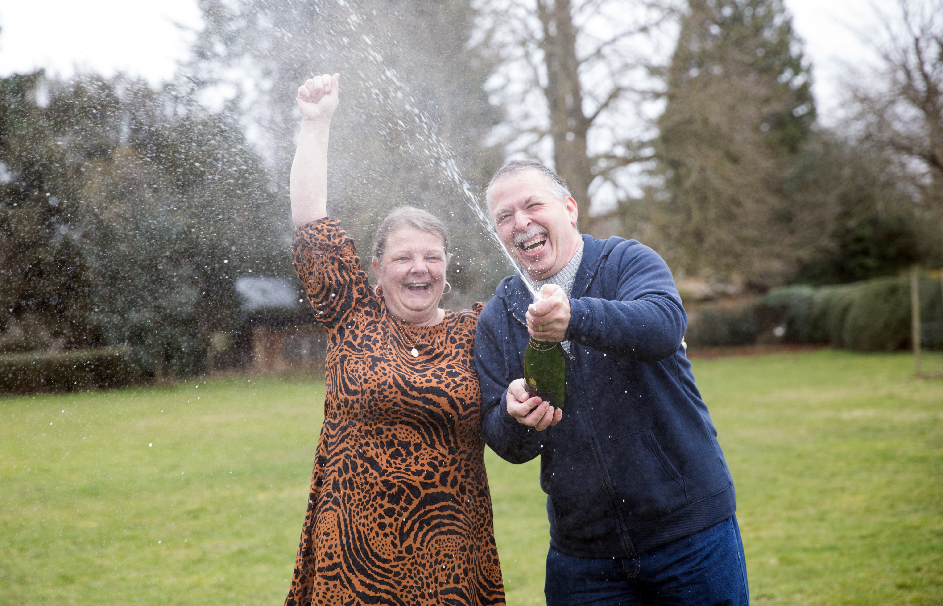 School dinner lady Karen Dakin celebrates with her husband Jeff after winning £1 million on the lottery (National Lottery/ PA)