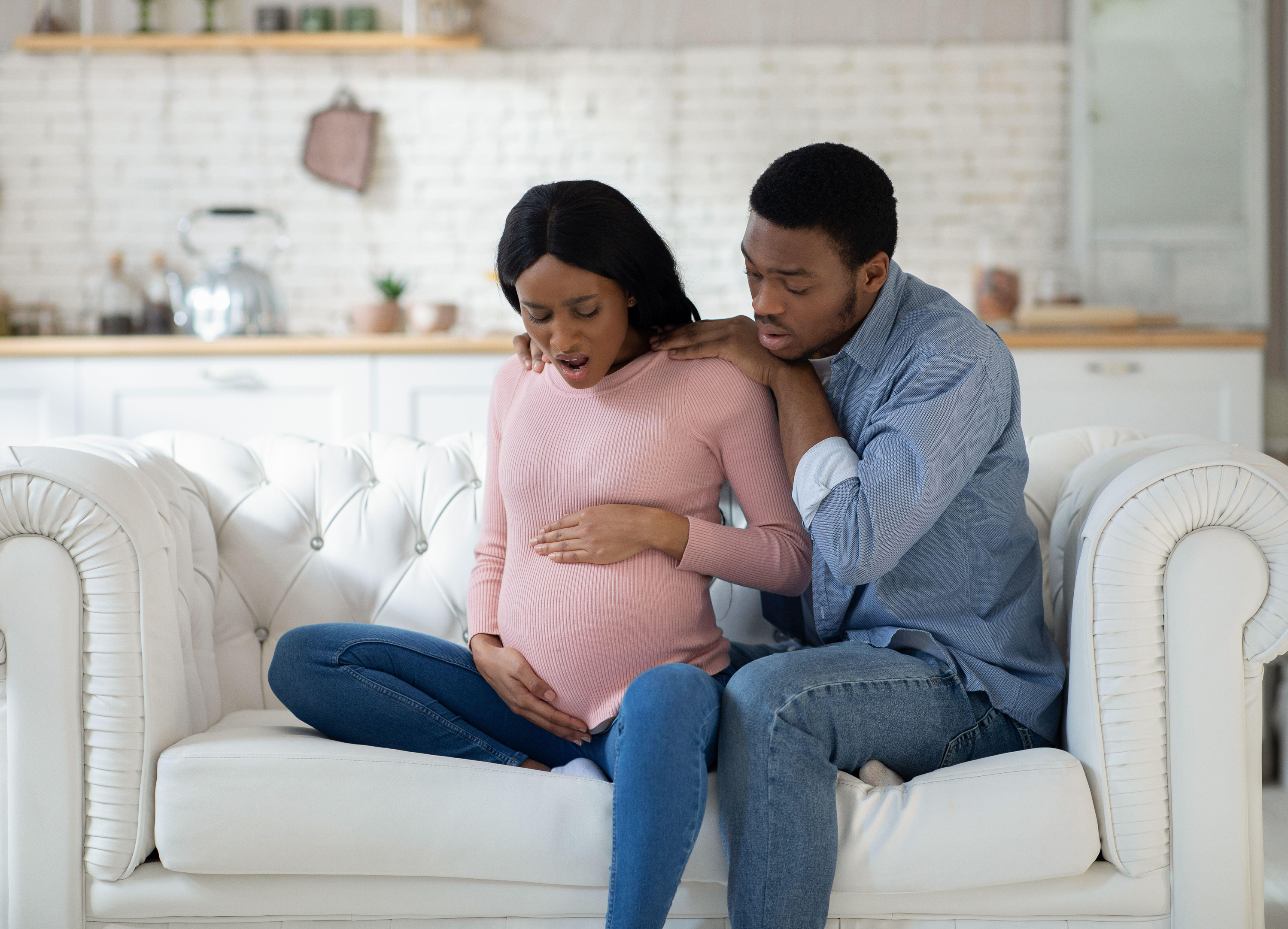 woman going into labour supported by partner