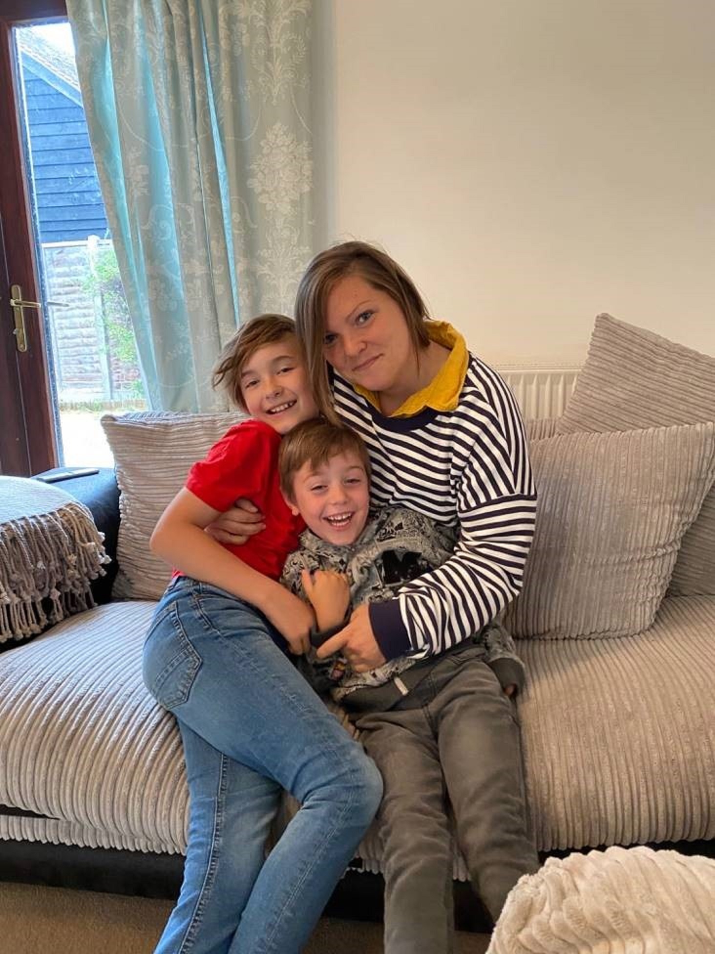 Sarah Smith, pictured with her nephews, gave a home to a child during the coronavirus pandemic