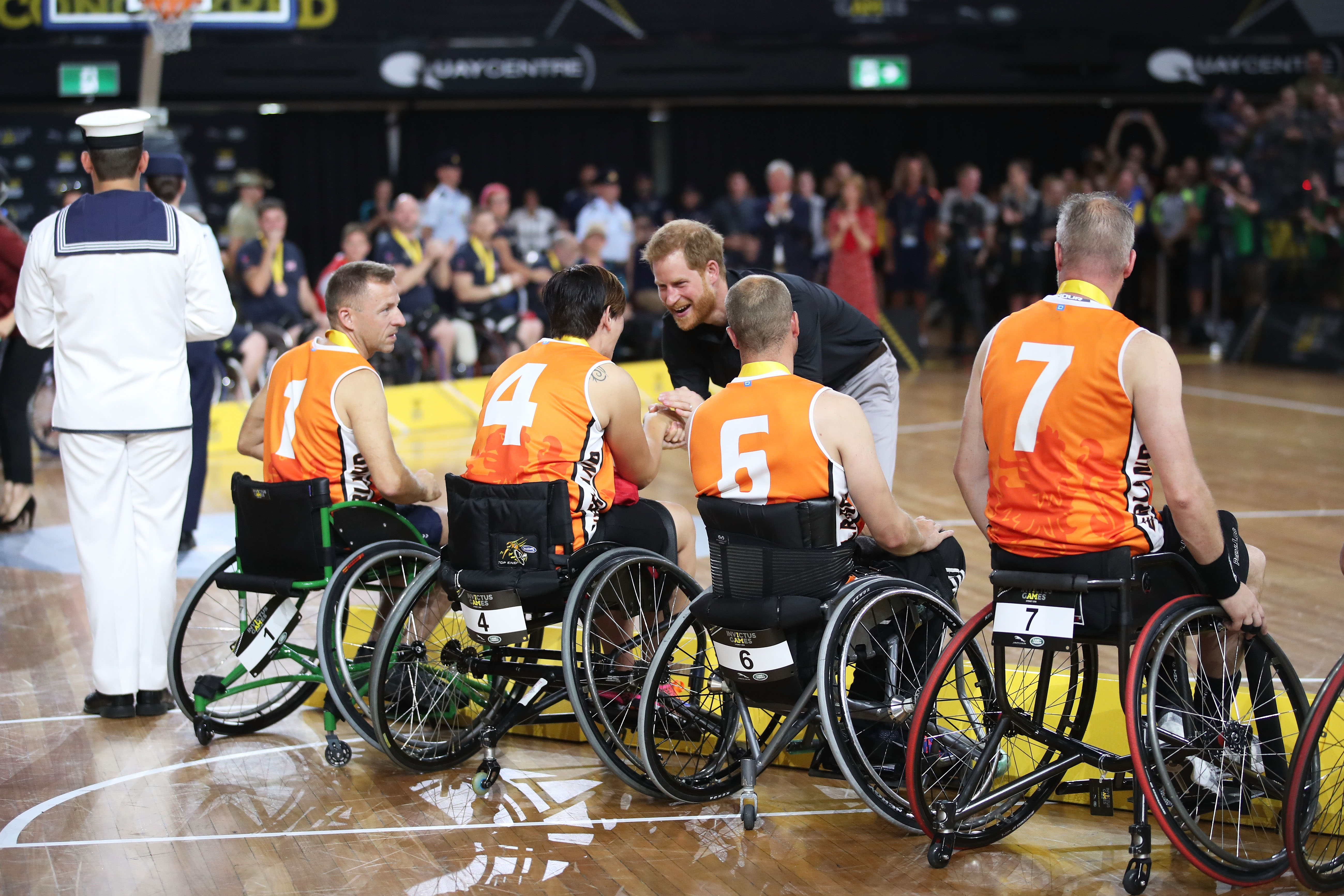 The The Duke of Sussex congratulates the silver medallists after the Wheelchair Basketball gold medal match during the Invictus Games in Sydney in 2018