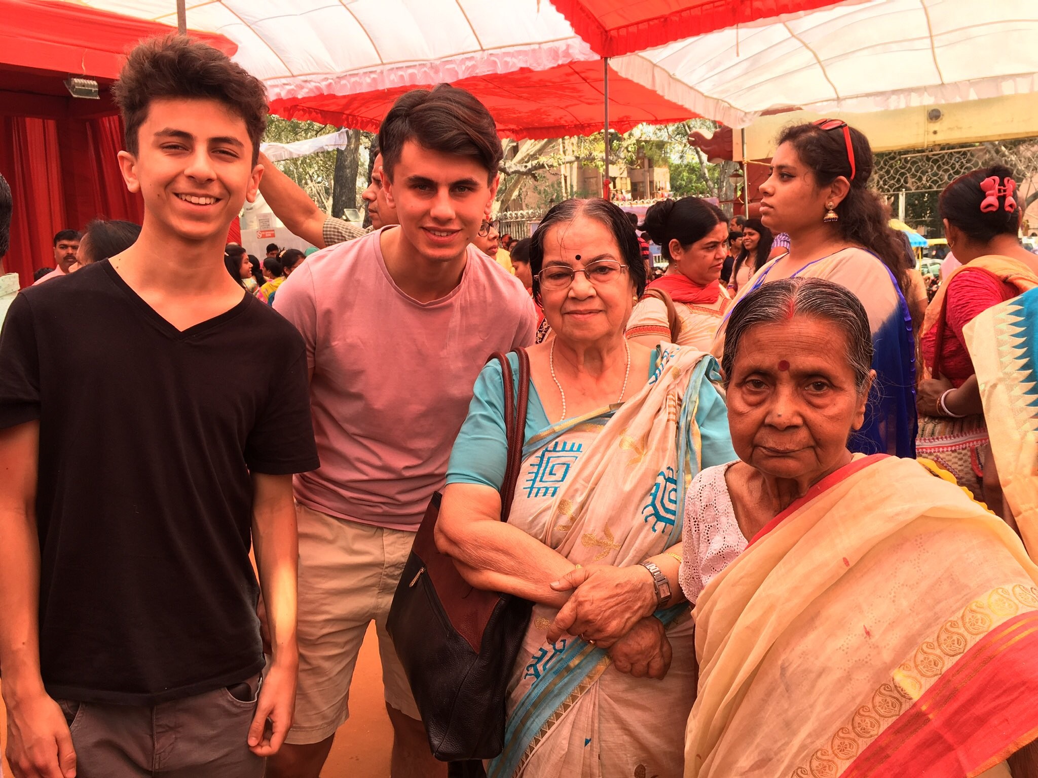 Namita Sinha, 82, (right) with her best friend and two grandsons in pre-Covid times