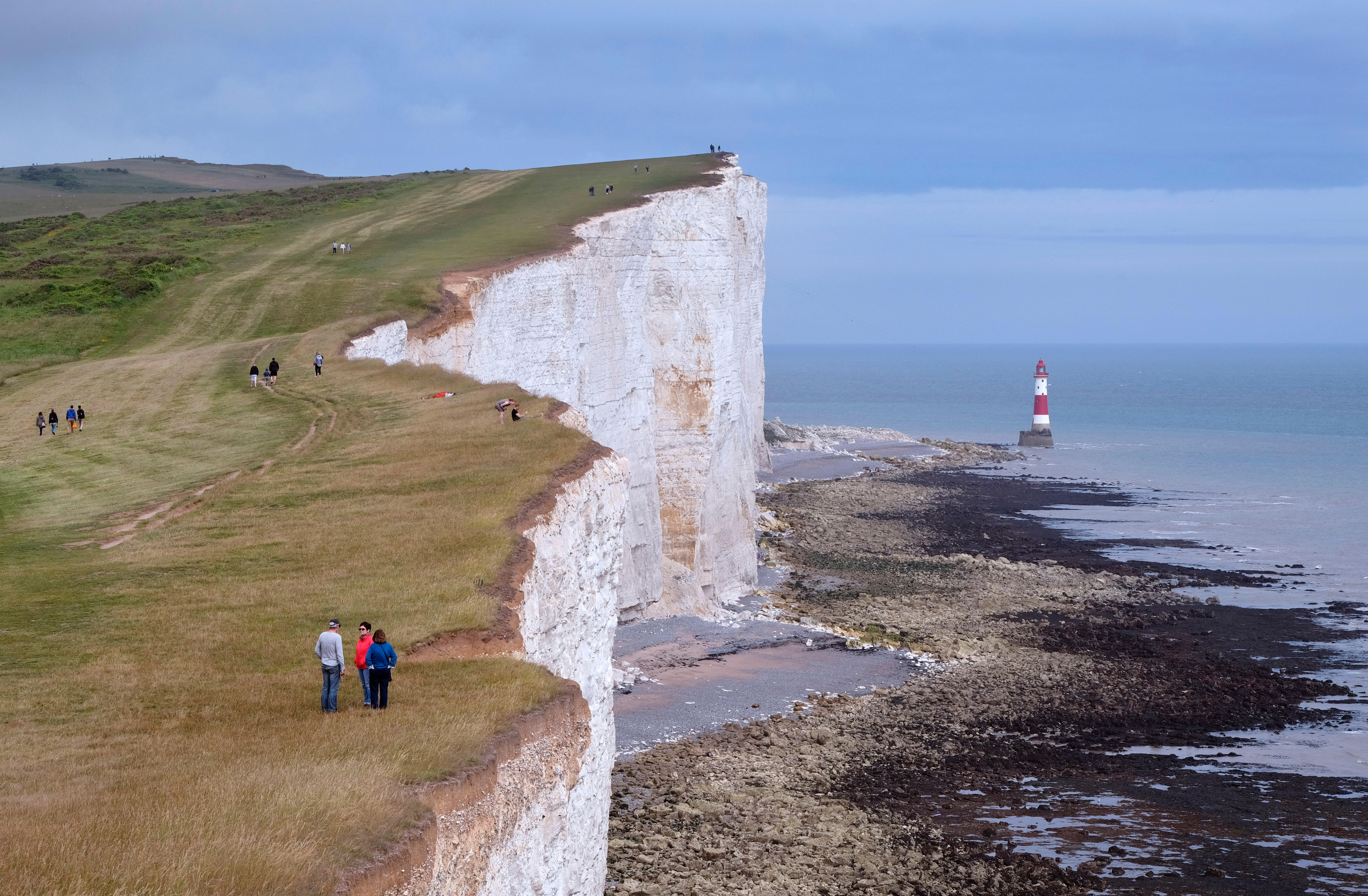 People on the South Downs Way footpath near Beachy Head, Eastbourne (Alamy/PA)
