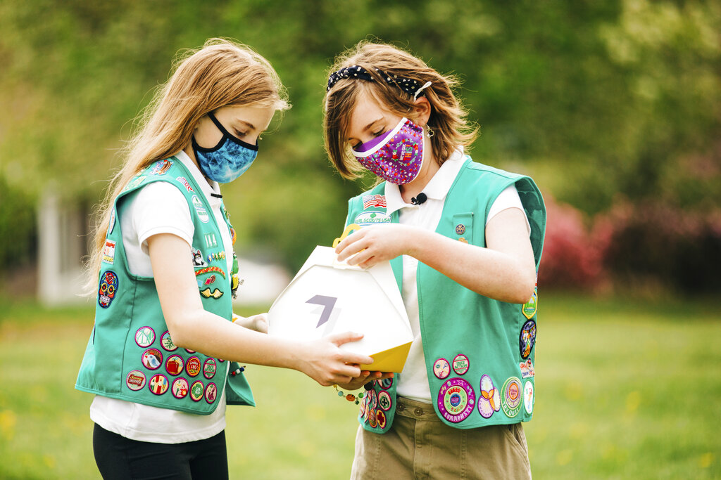 Girl Scouts Alice Goerlich and Gracie Walker prepare a delivery