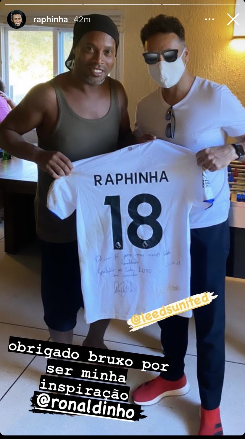 Ronaldinho holds a Leeds shirt