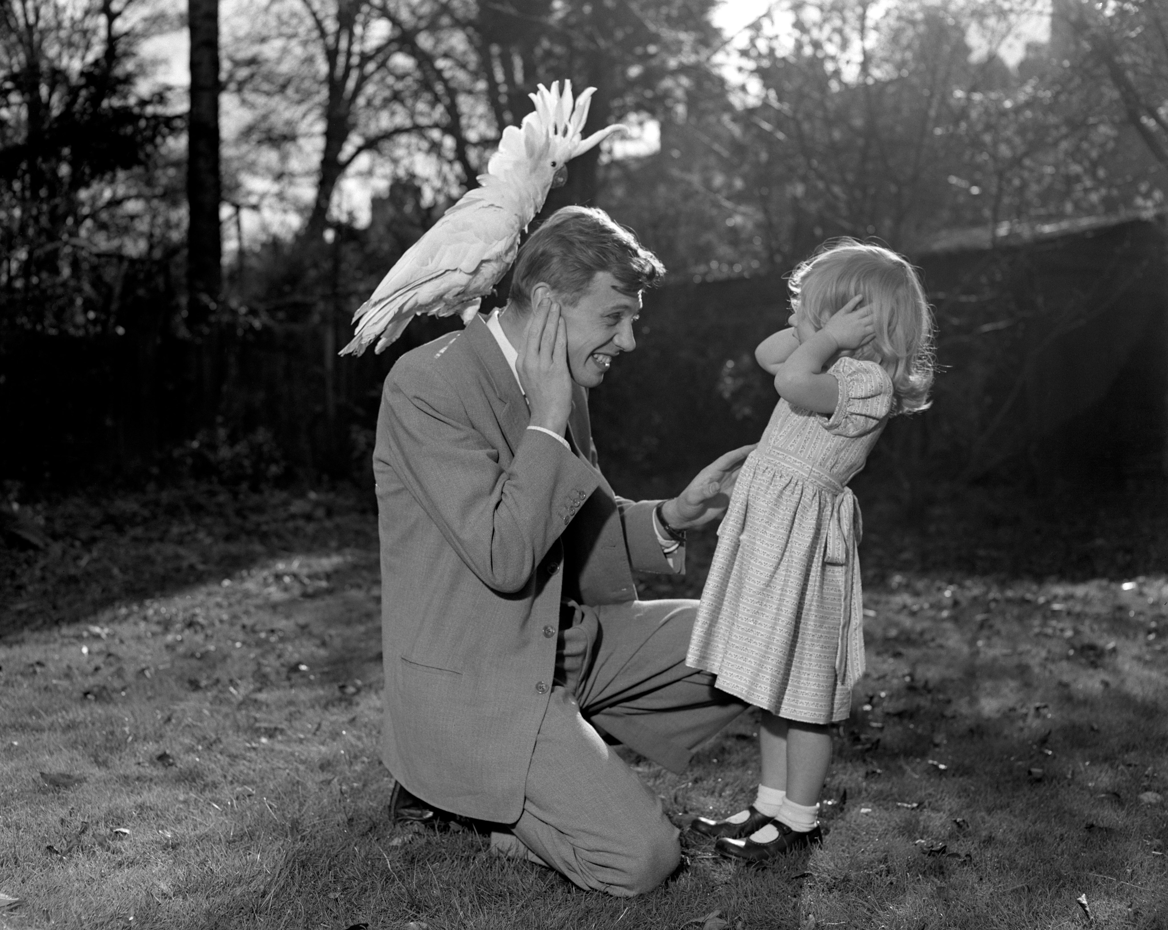 David Attenborough and his daughter Susan with a sulphur-crested cockatoo called Georgie in 1957