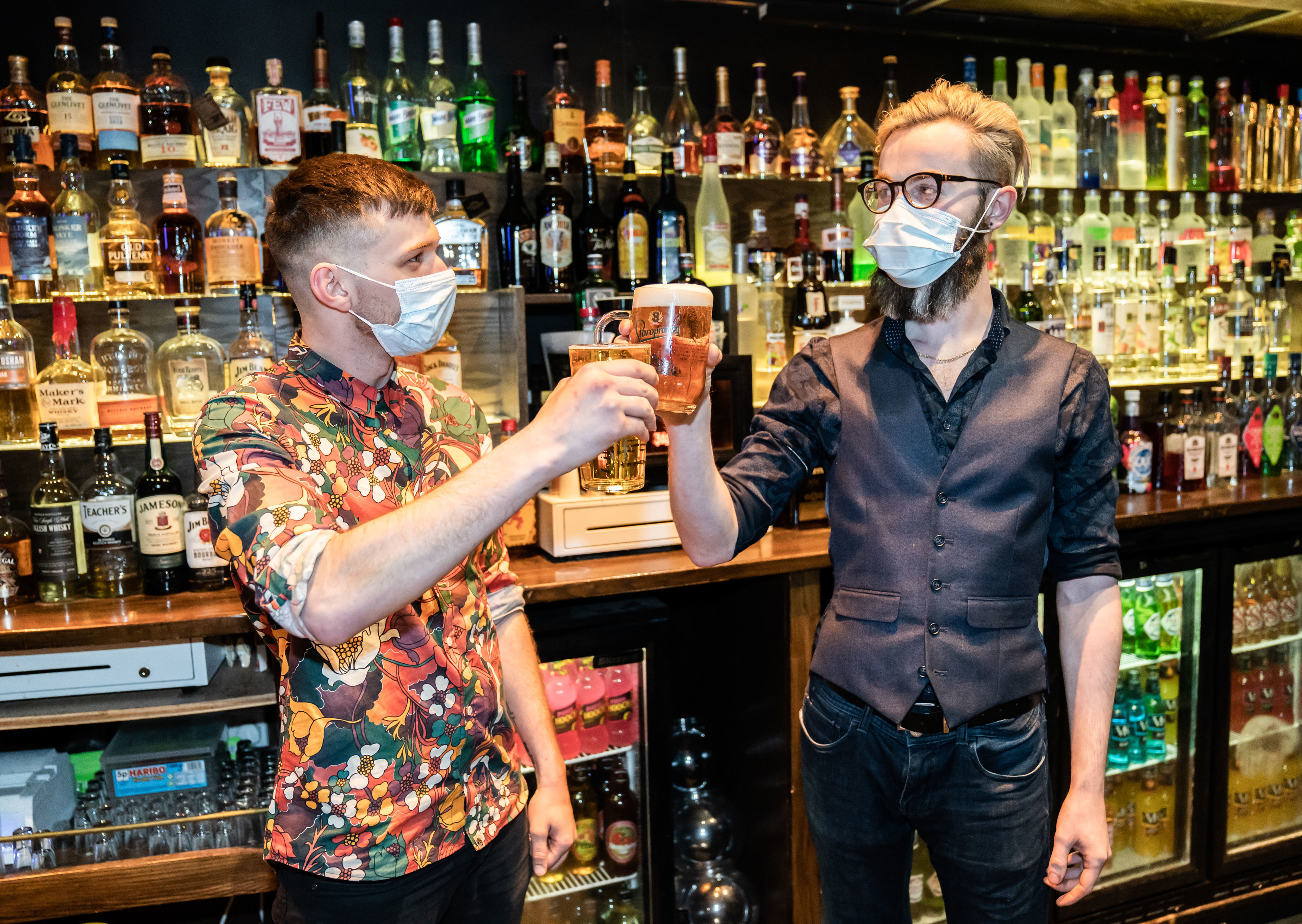 Bar staff celebrate in the Showtime Bar at 00:00 in Huddersfield, West Yorkshire, as indoor hospitality and entertainment venues reopen to the public