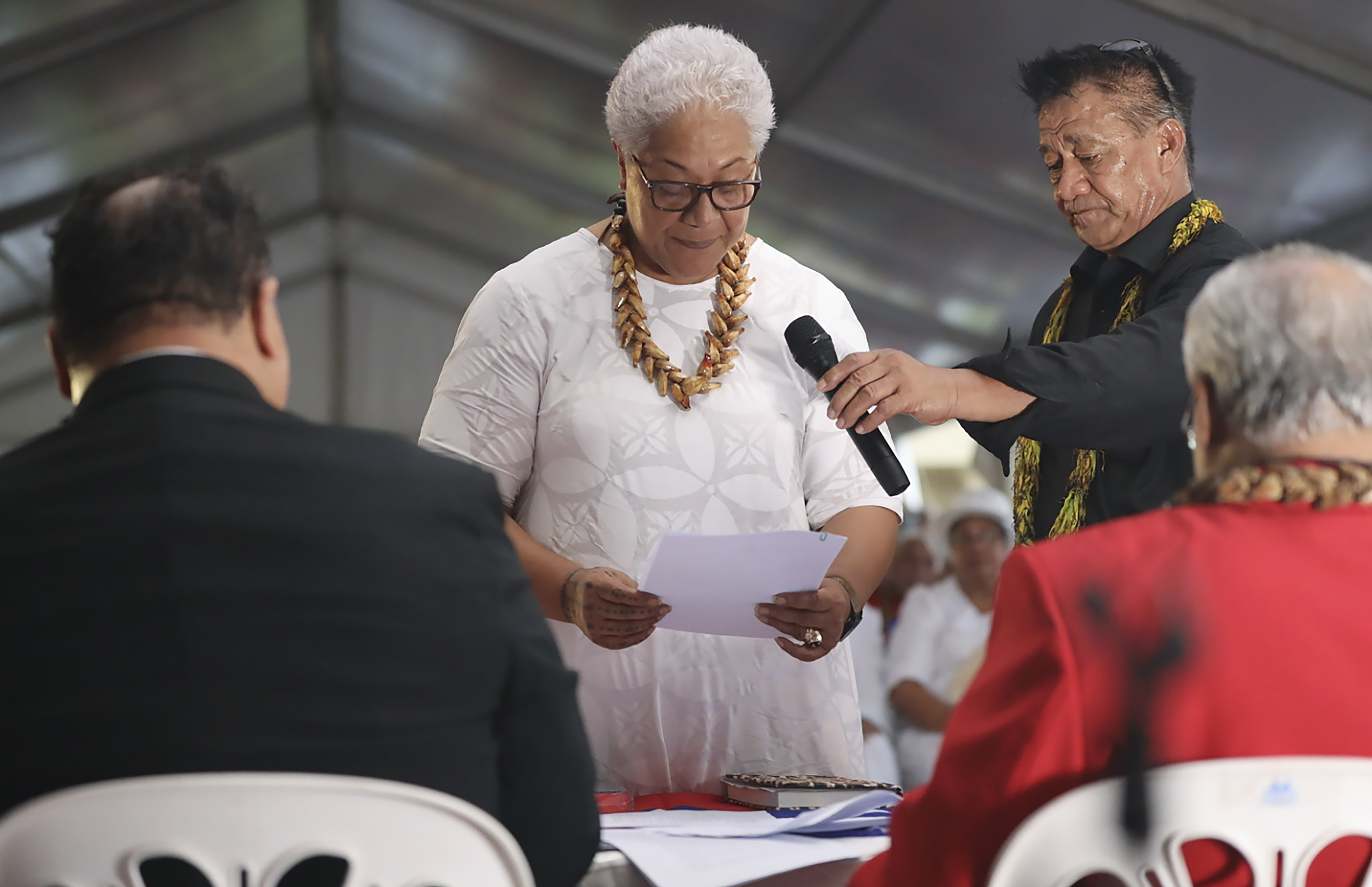 Samoa's prime minister-elect Fiame Naomi Mata'afa takes her oath at an unofficial ceremony outside parliament house in Apia