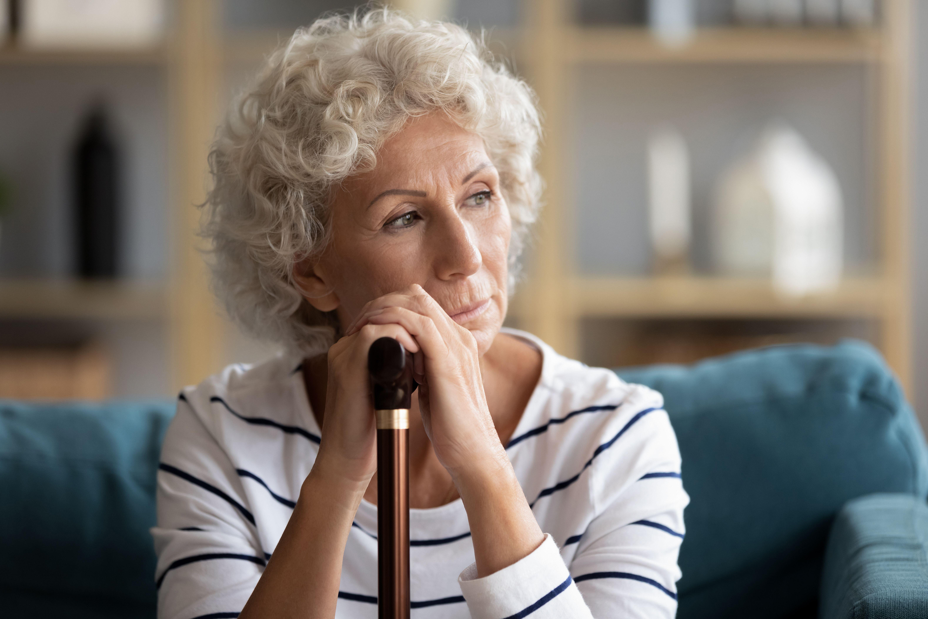 Mature woman deep in thought