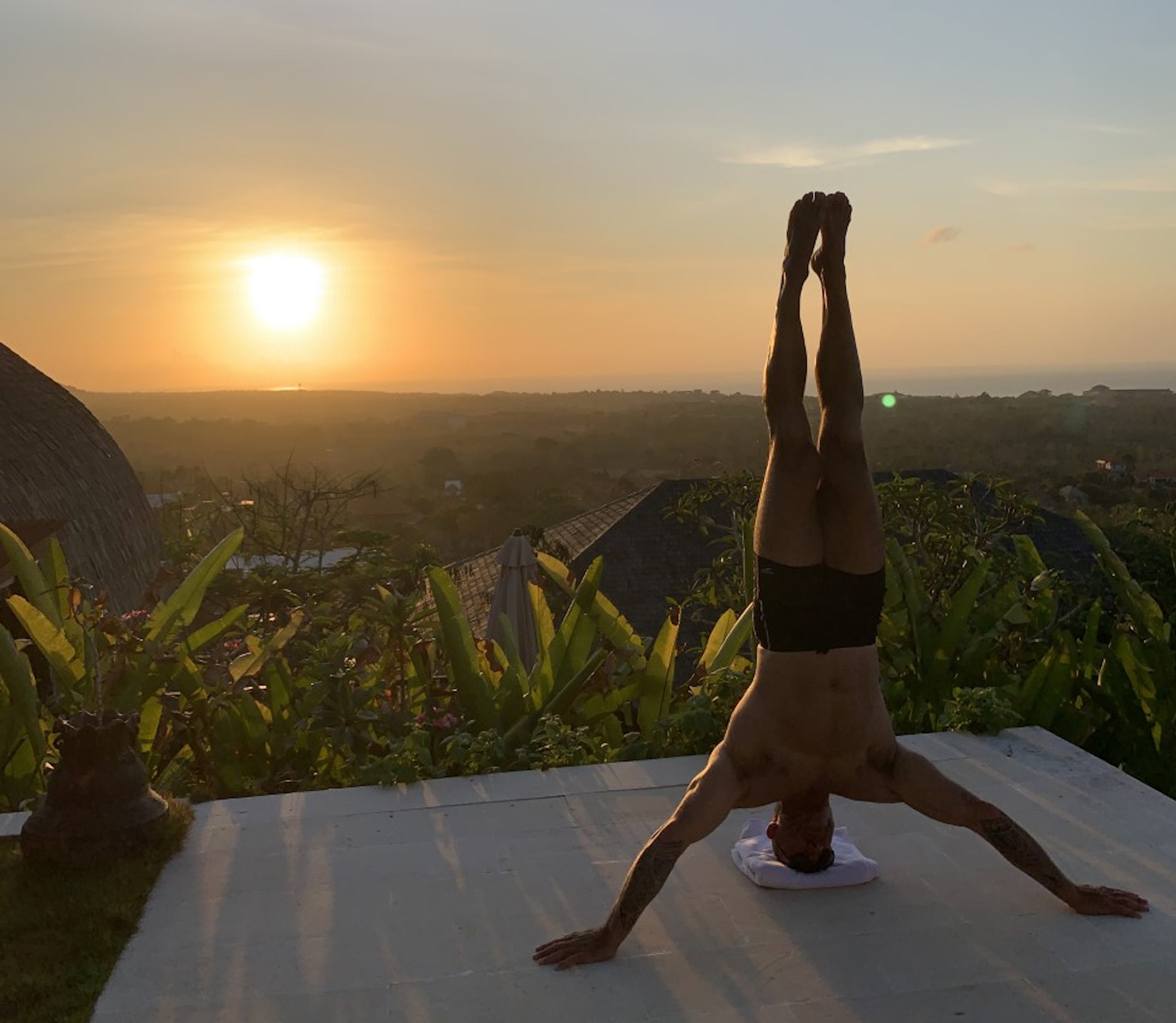 James crossley doing a headstand in bali